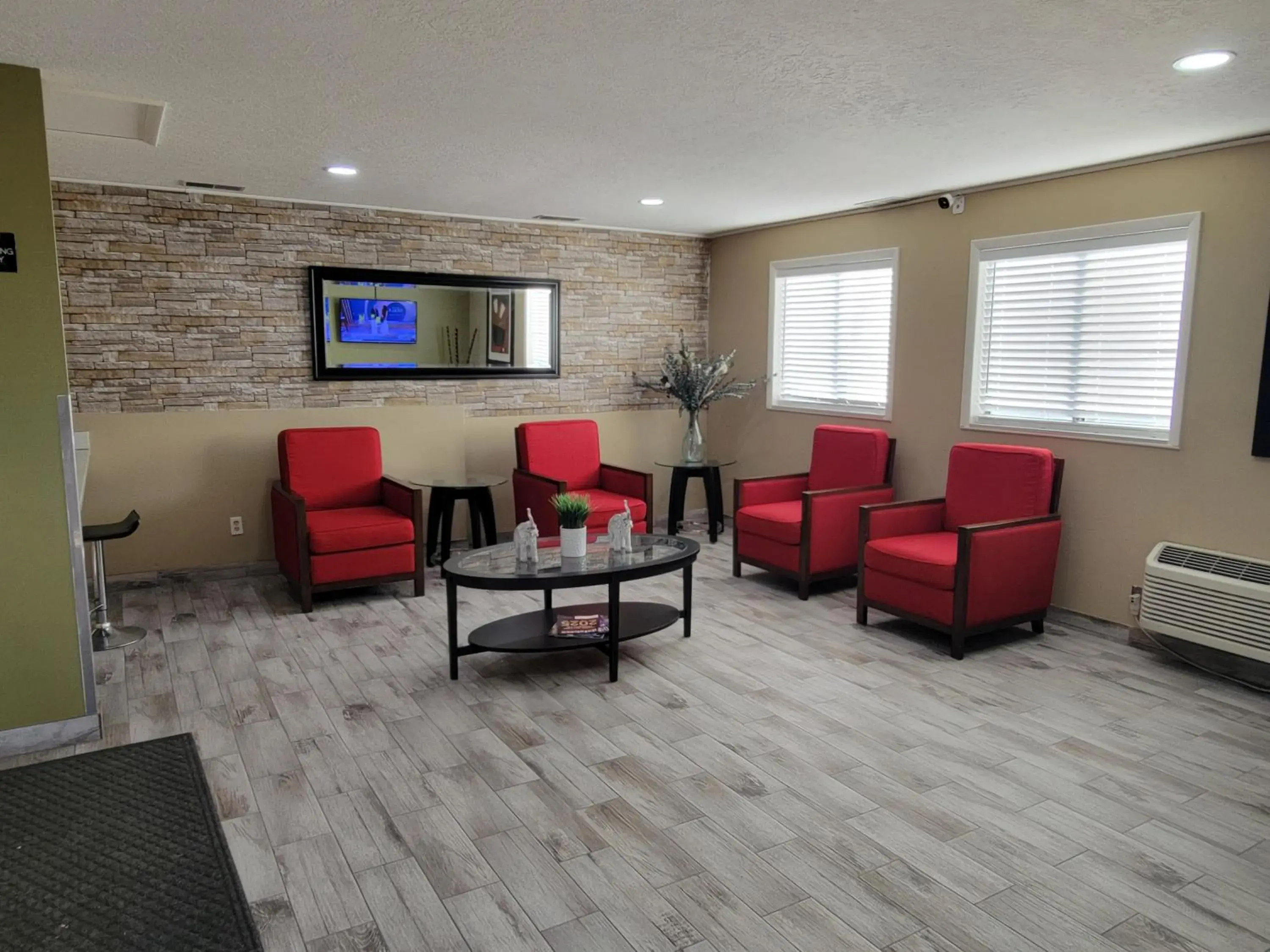 Lobby or reception in Super 8 by Wyndham Logan Lobby or reception in Super 8 by Wyndham Logan