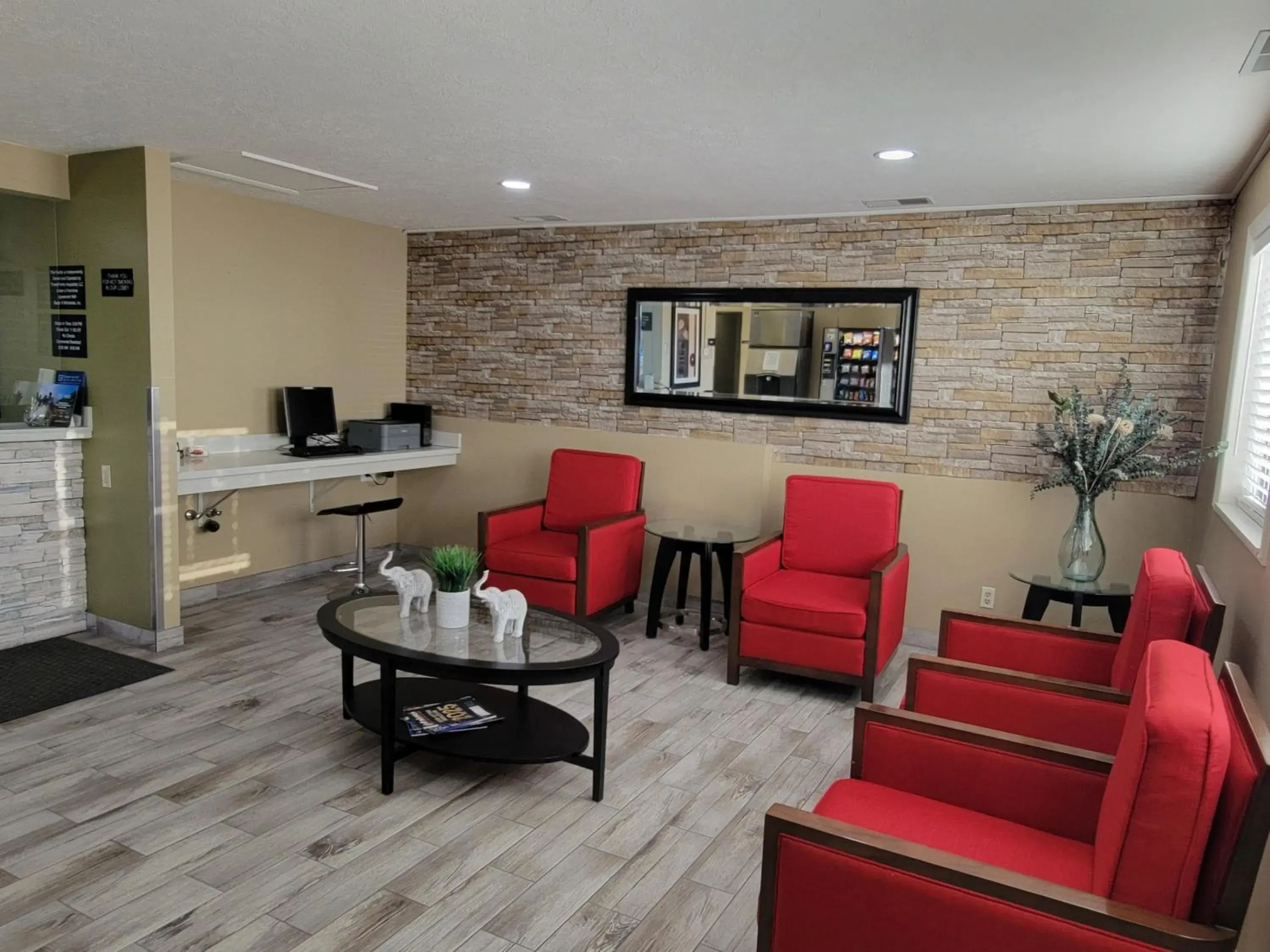 Lobby or reception in Super 8 by Wyndham Logan Lobby or reception in Super 8 by Wyndham Logan