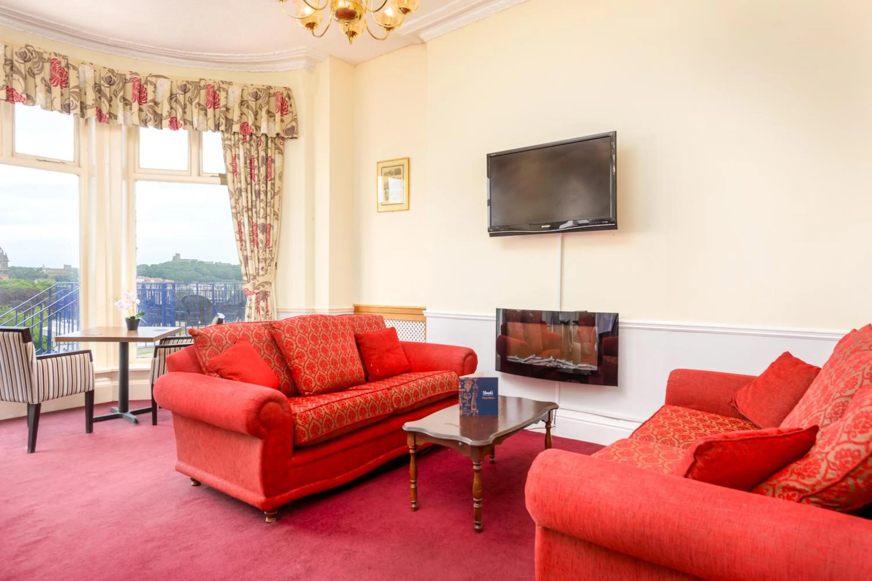 Communal lounge/ TV room in The Esplanade Hotel