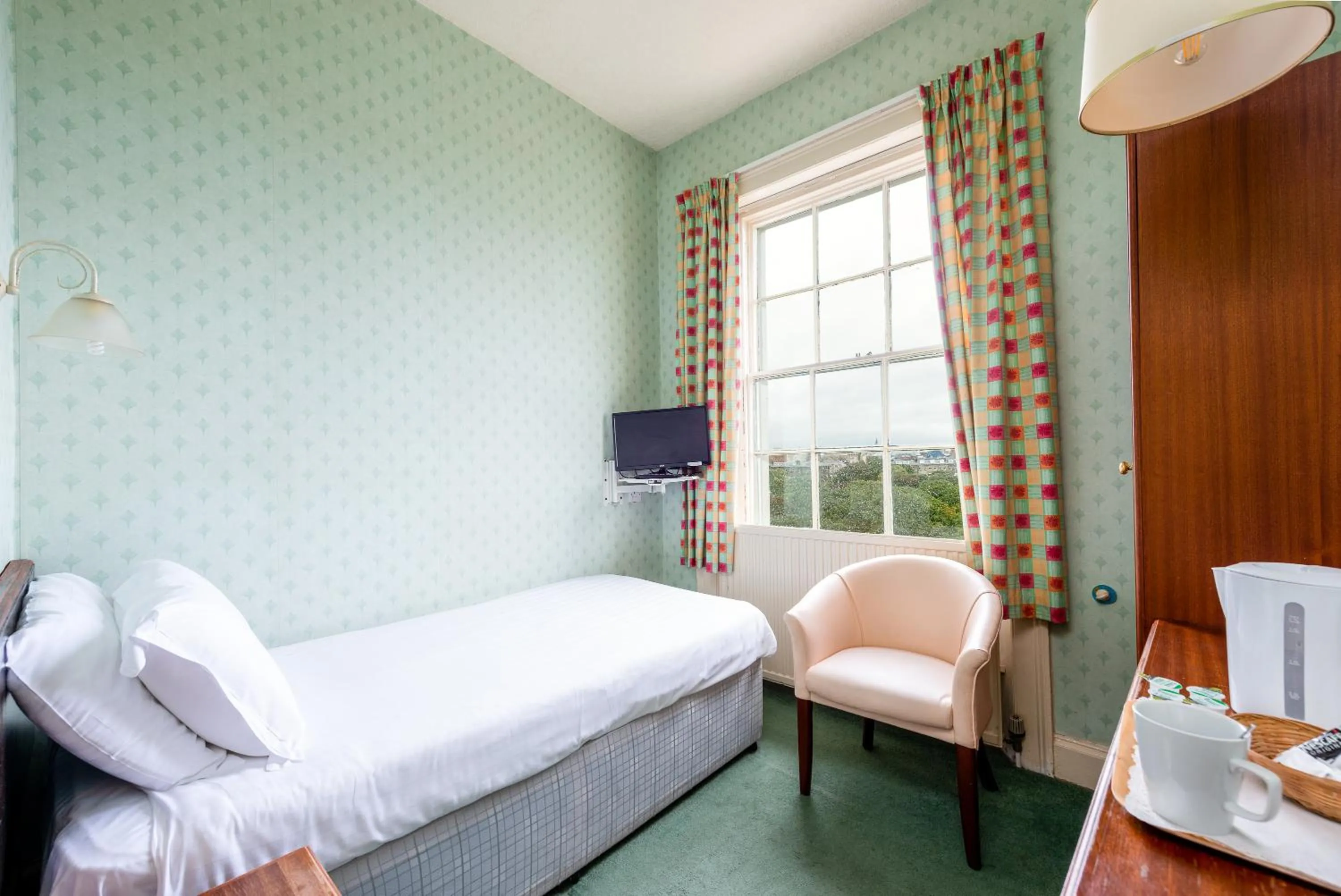 Bed in The Esplanade Hotel