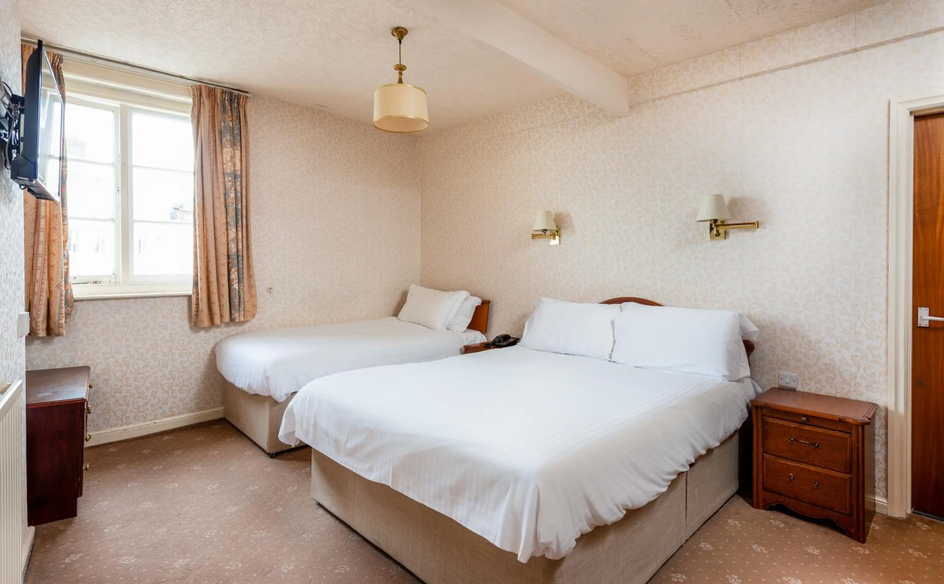 Bed in The Esplanade Hotel