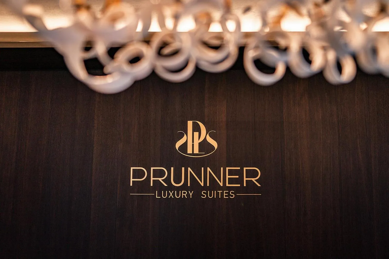 Property logo or sign in Prunner Luxury Suites - Adults Only
