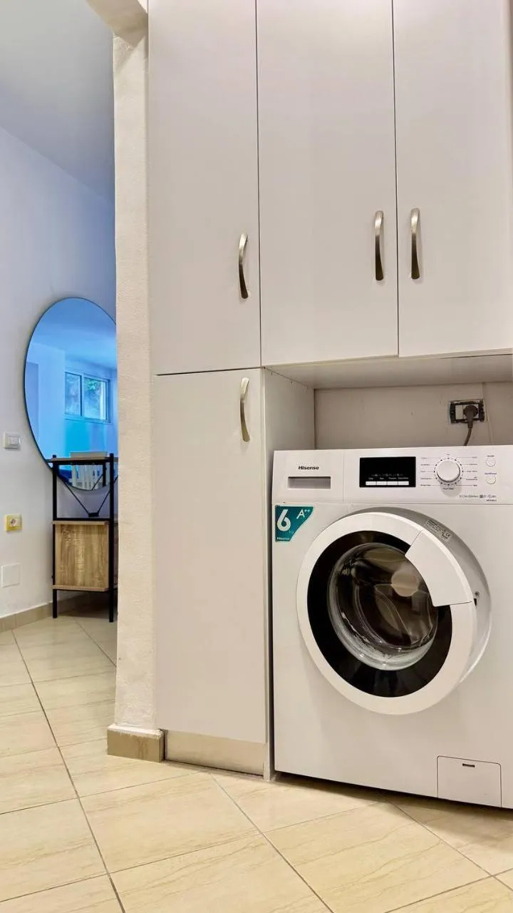 washing machine in Sail View Boutique Apartment