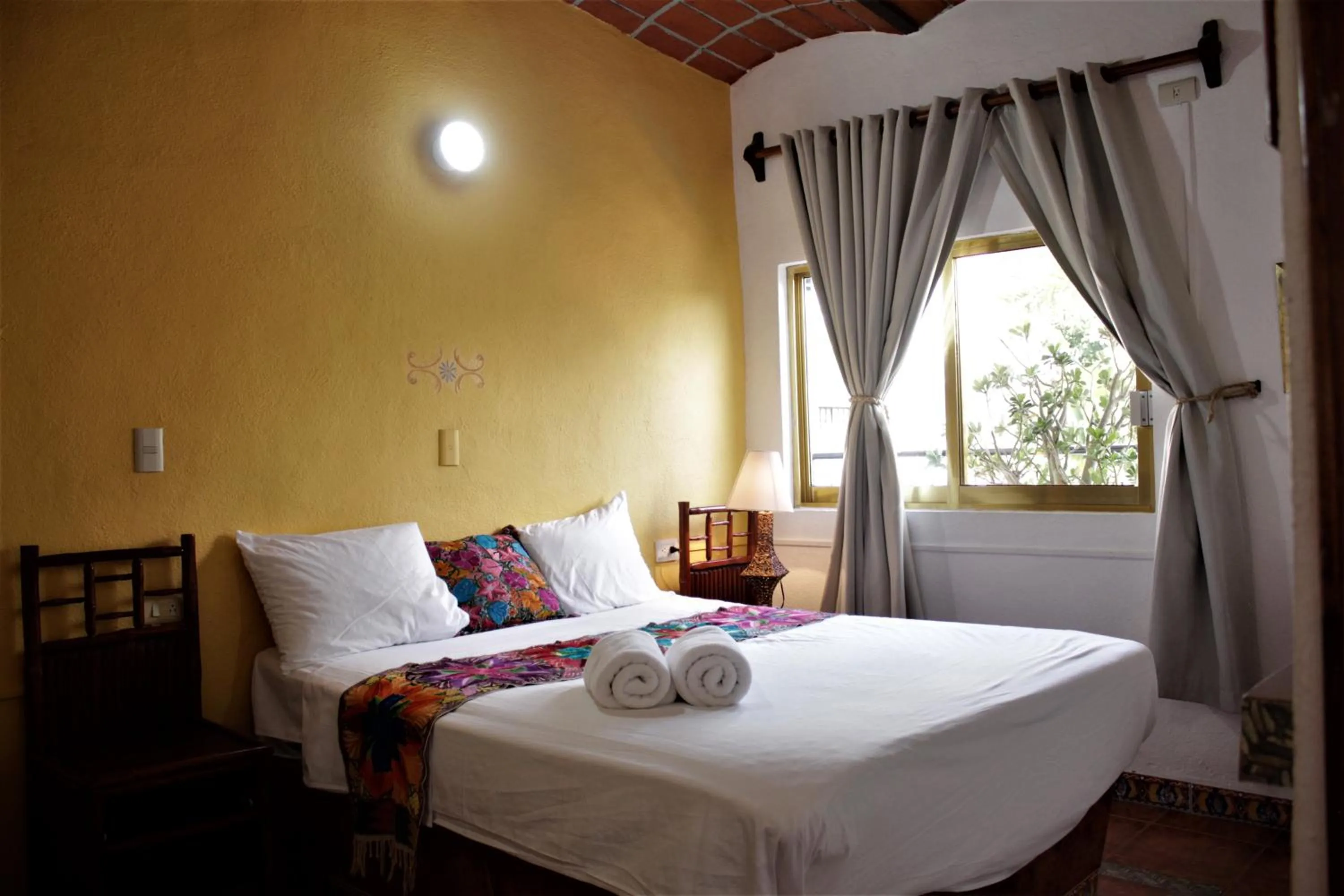 Photo of the whole room, Bed in Hotel Diamante Sayulita