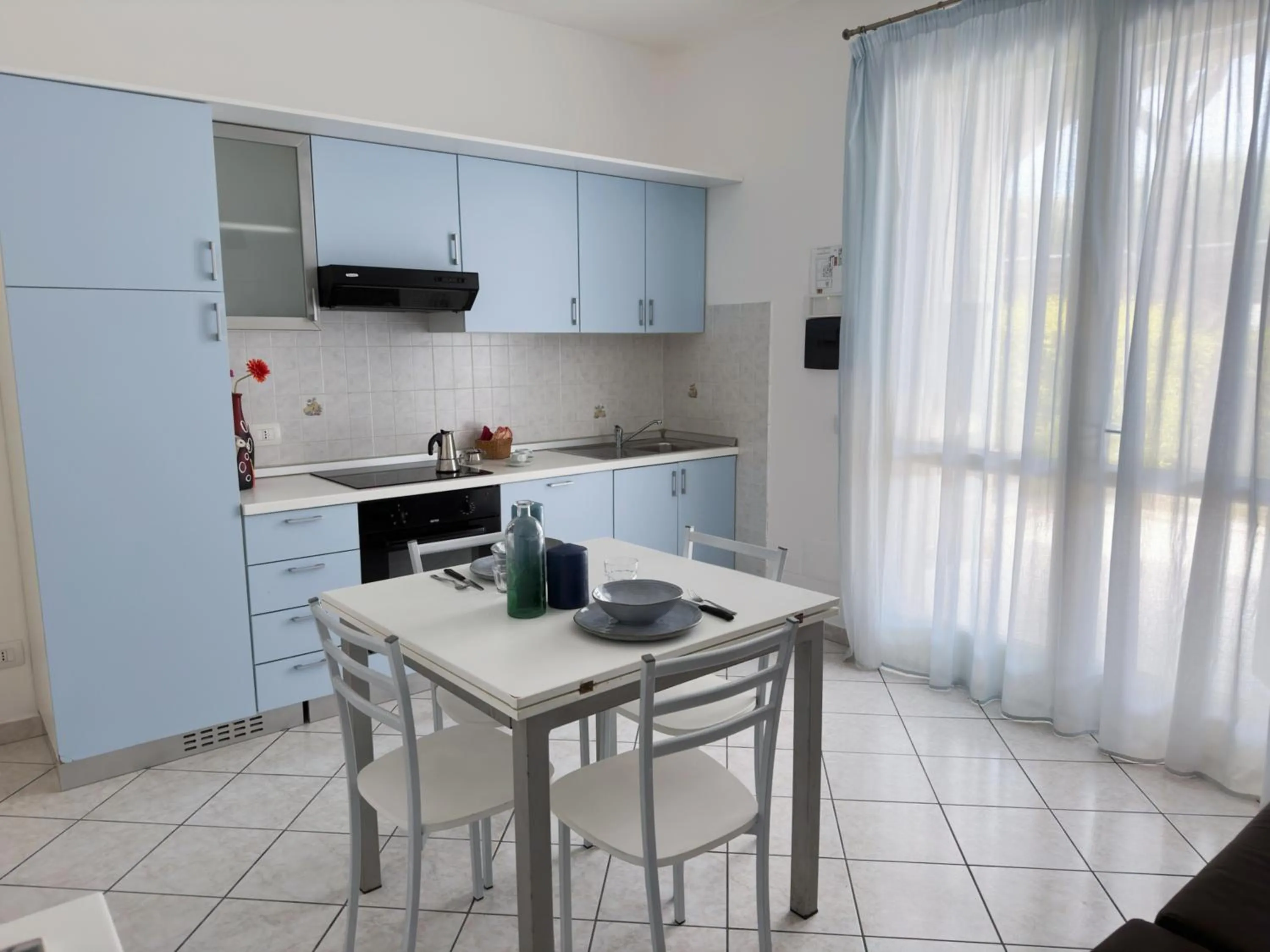 Kitchen or kitchenette in Airone Bianco Residence Village