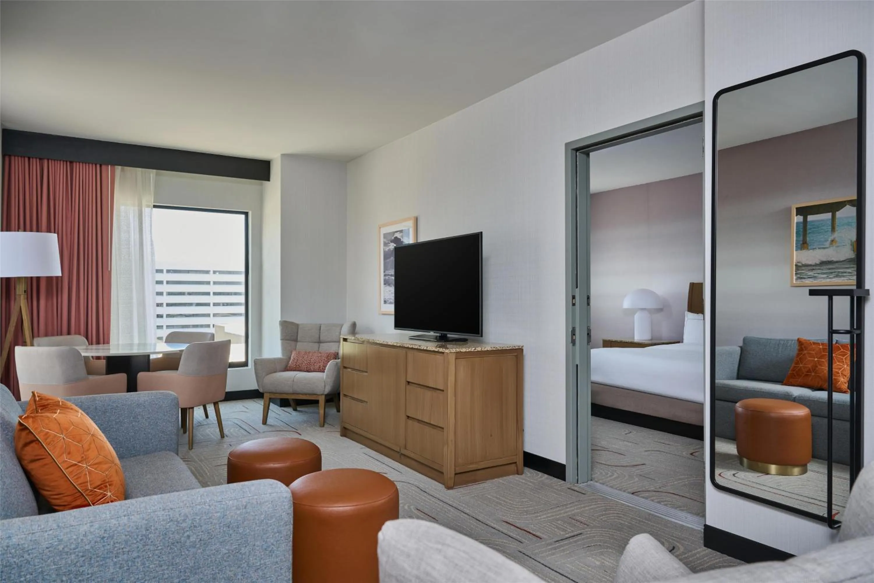 Living room, Bed in Hotel Zessa Orange County Airport, a DoubleTree by Hilton