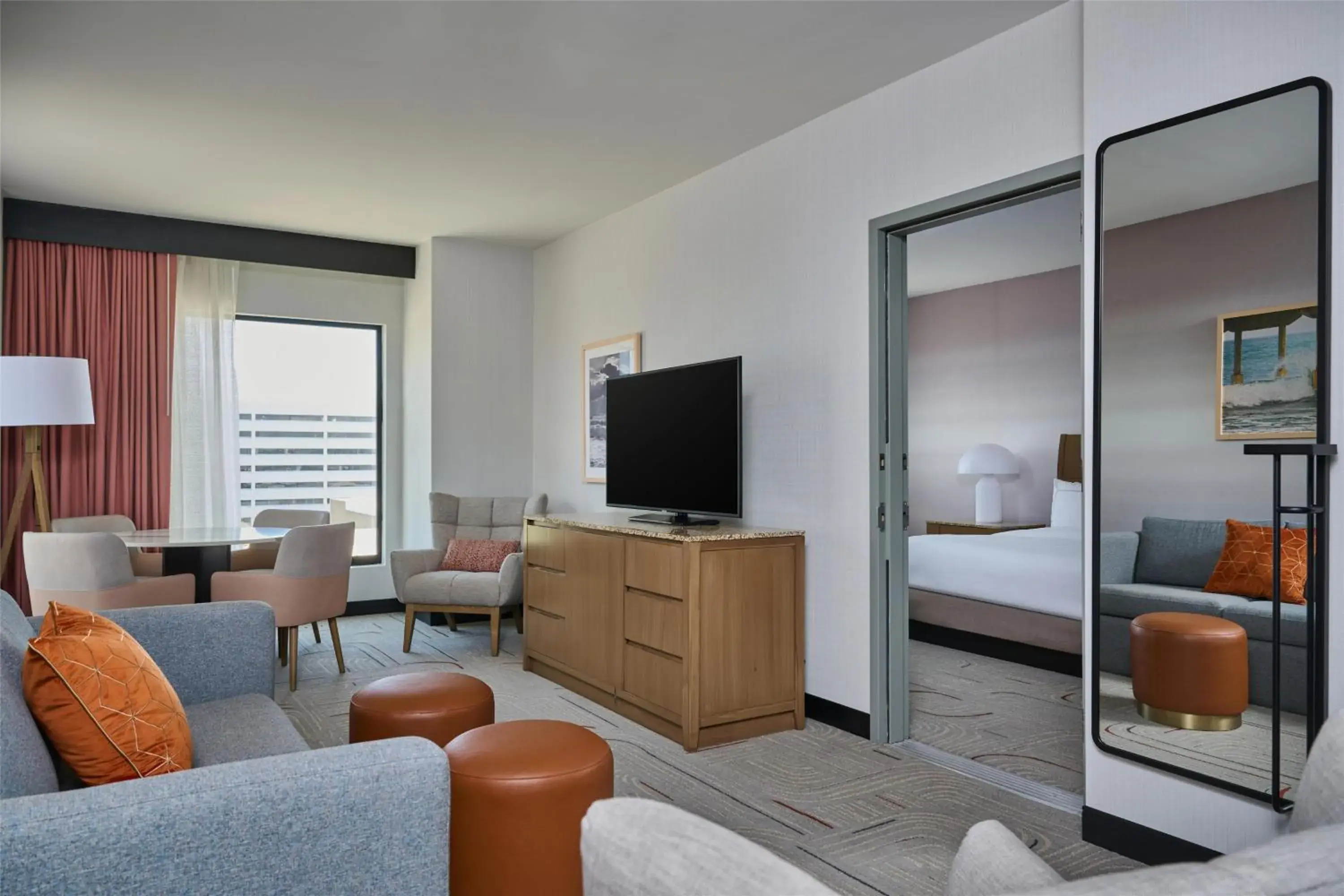 Living room, Bed in Hotel Zessa Orange County Airport, a DoubleTree by Hilton Living room, Bed in Hotel Zessa Orange County Airport, a DoubleTree by Hilton