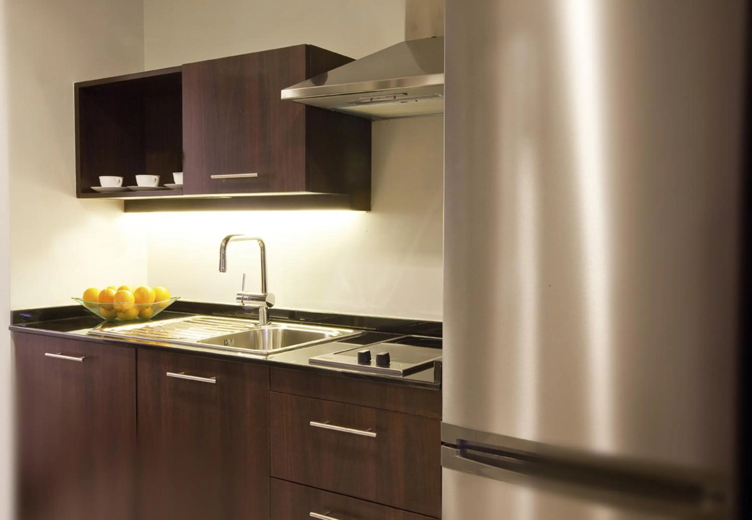 Kitchen or kitchenette in Mövenpick Hotel Apartments Al Mamzar Dubai