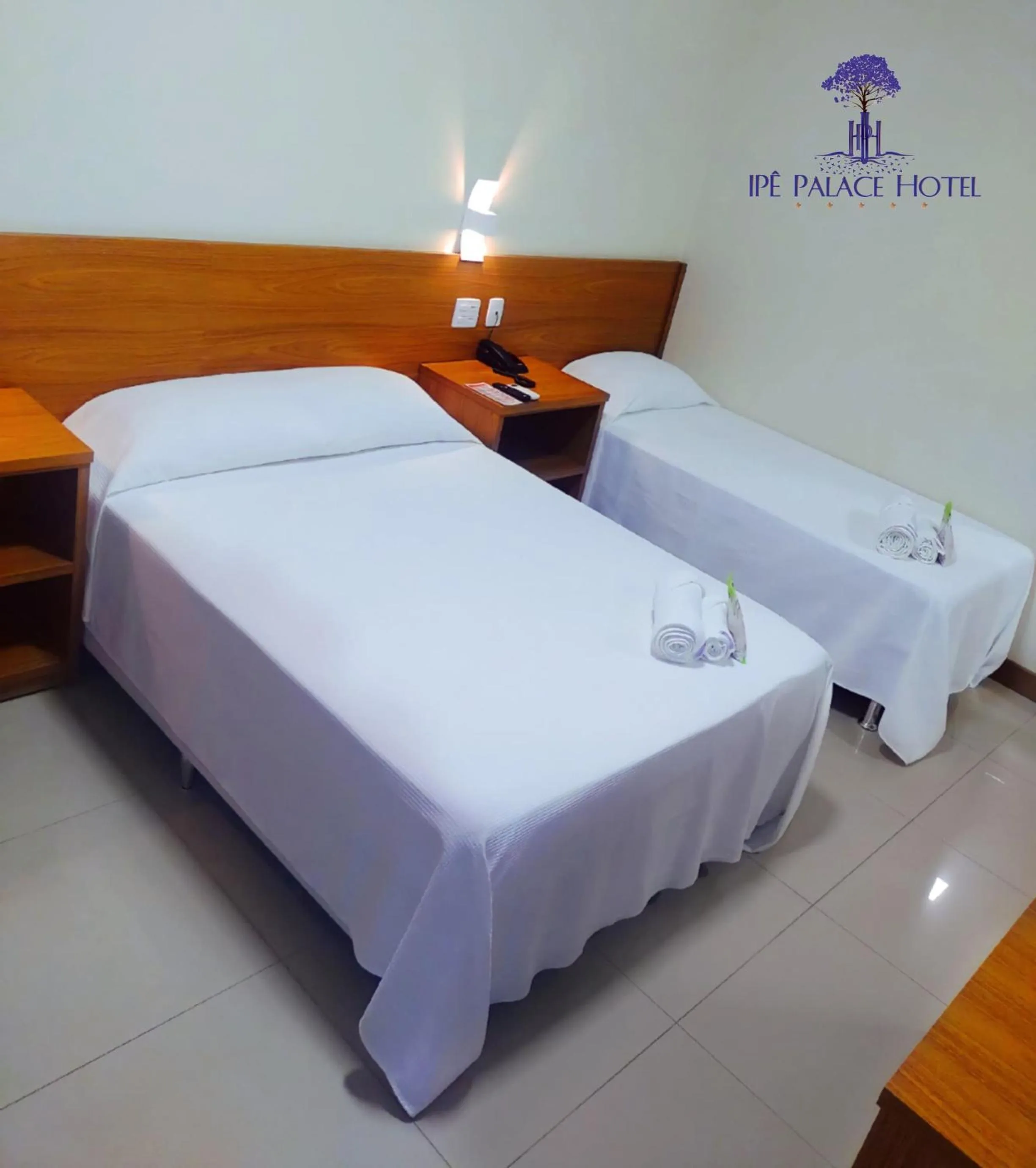 Bed in Ipê Palace Hotel