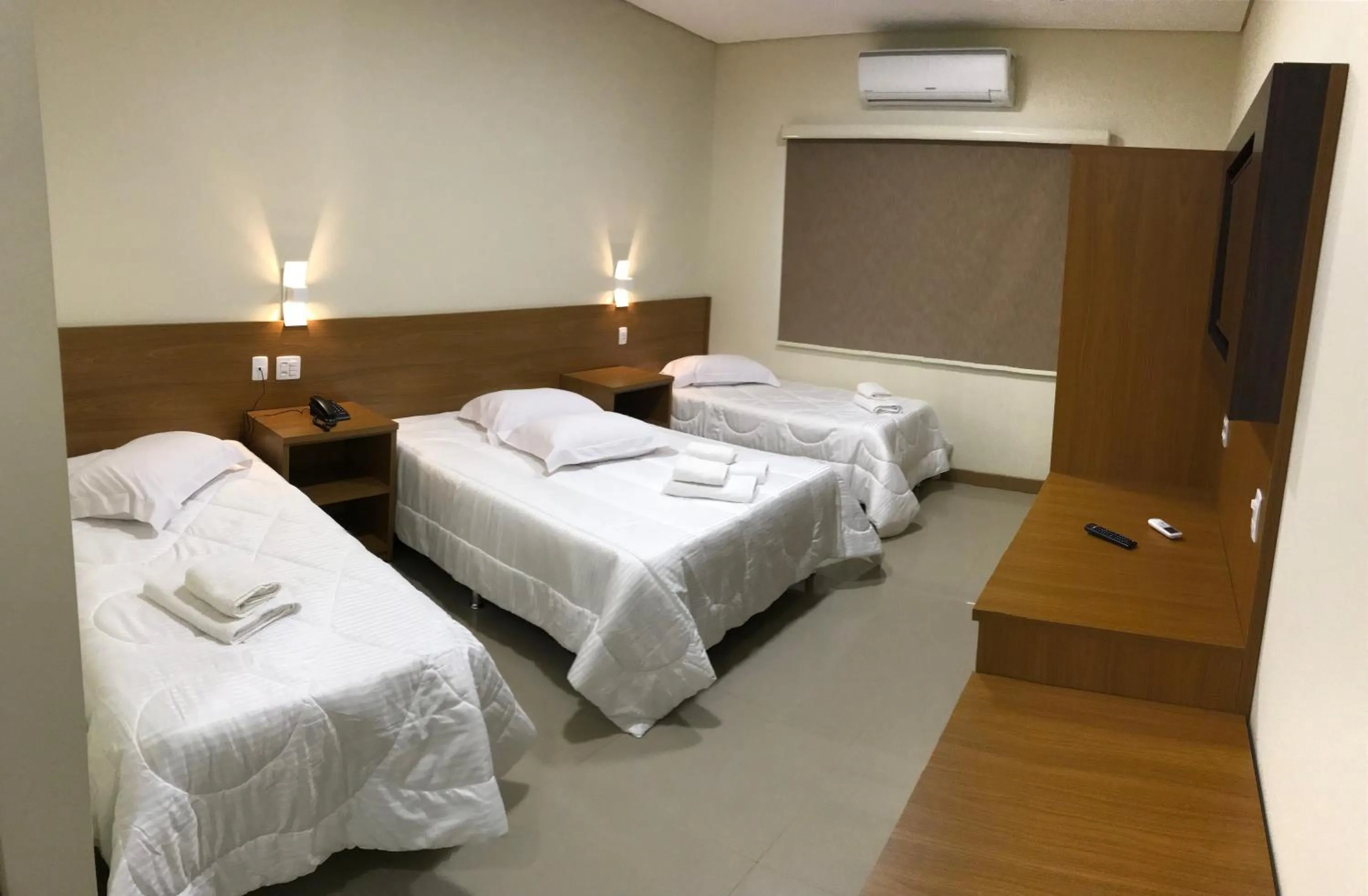 Bed in Ipê Palace Hotel