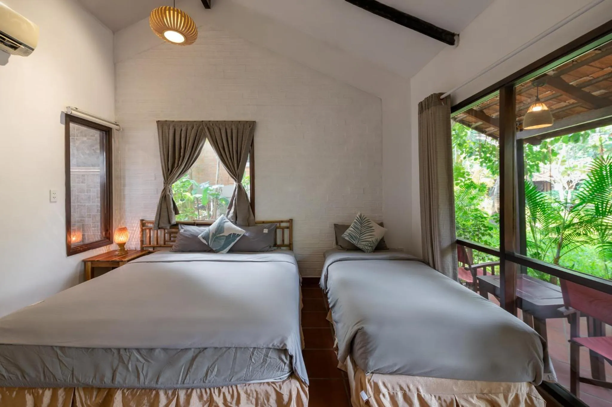 Photo of the whole room, Bed in An Nhien Retreat Phu Quoc with Yoga Daily & Beach access