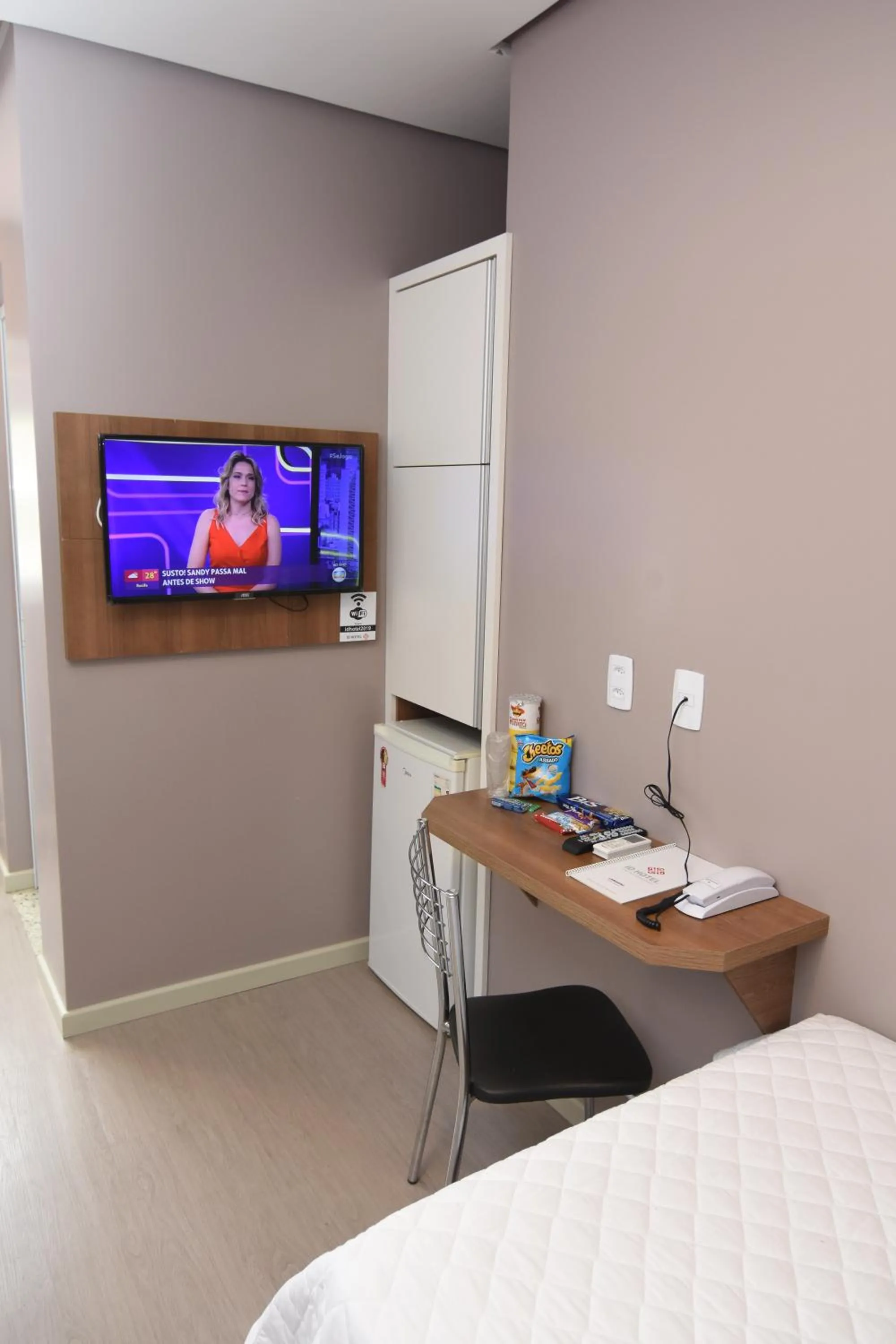Seating area, Bed in ID Hotel