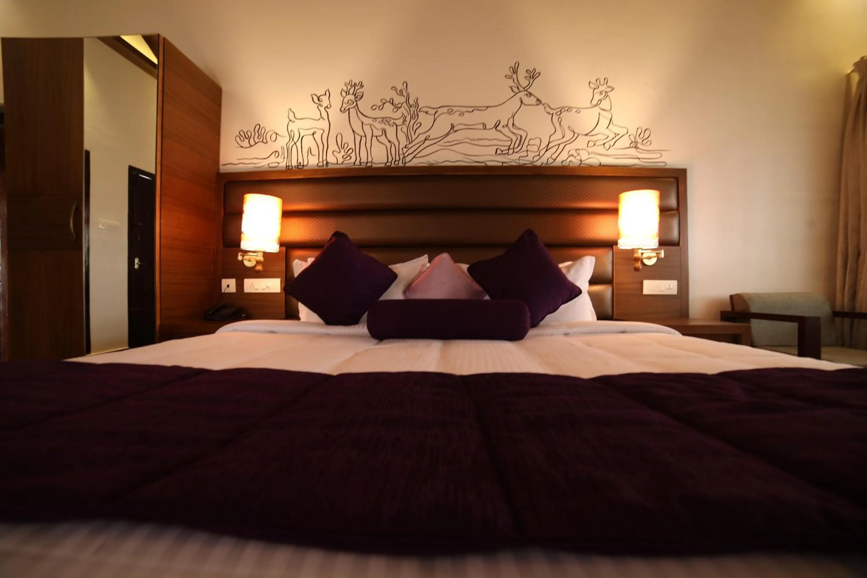 Bed in CONTOUR ISLAND RESORT & SPA , wayanad