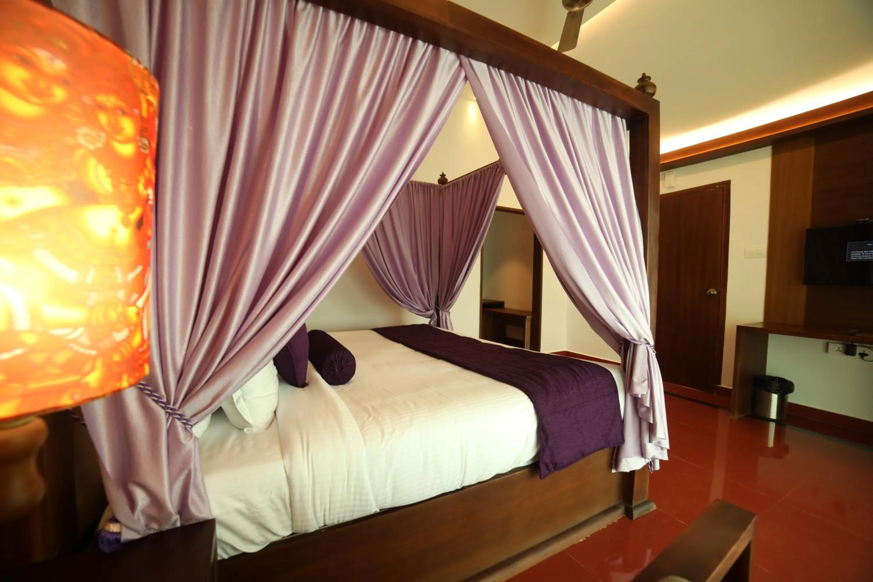 Bed in CONTOUR ISLAND RESORT & SPA , wayanad