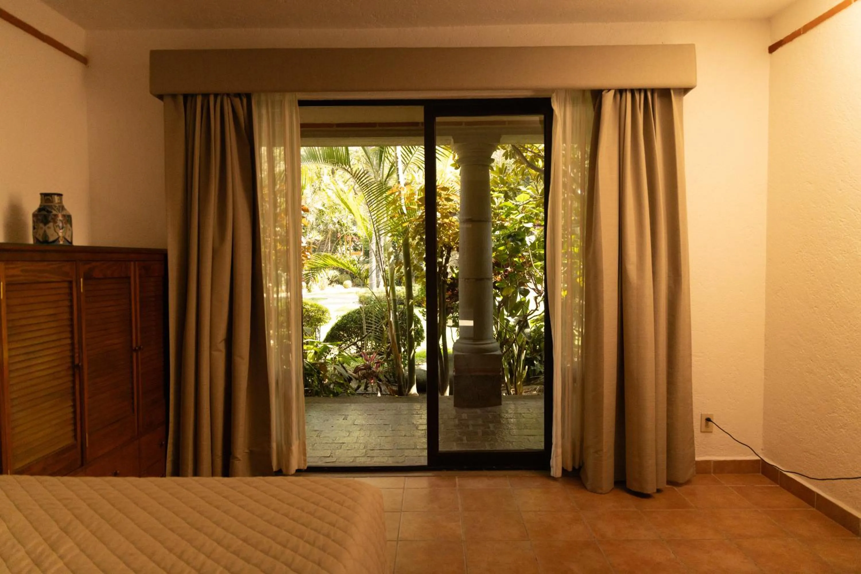 Bed in La Buena Vibra Wellness Resort & Spa