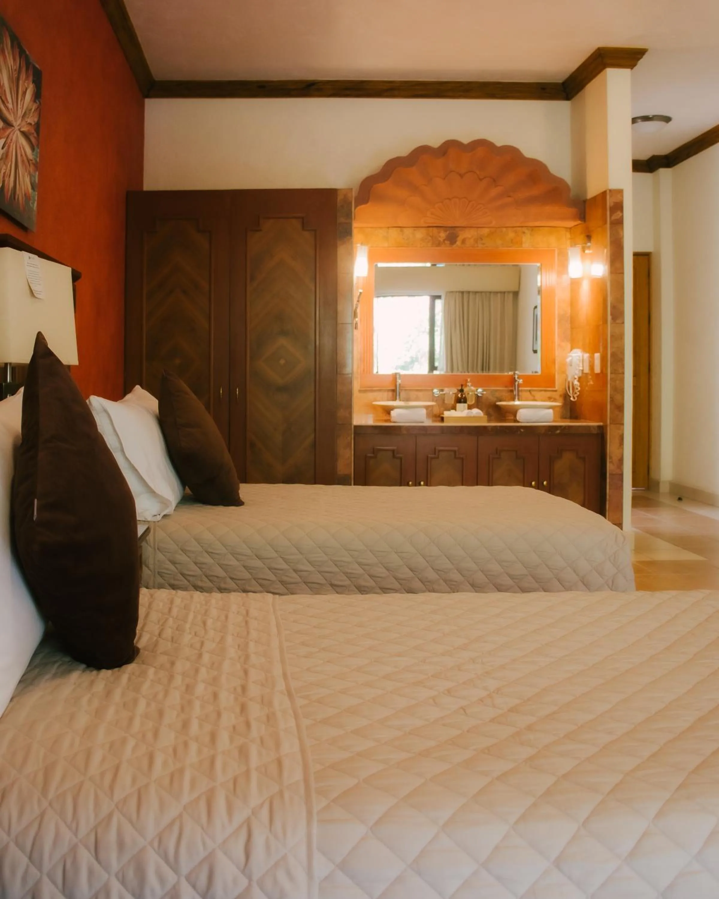 Bed in La Buena Vibra Wellness Resort & Spa