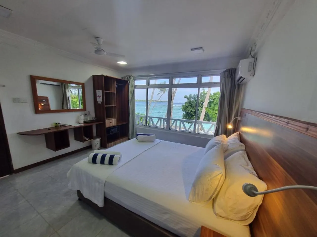 Property building, Bed in Batuta Maldives Surf View
