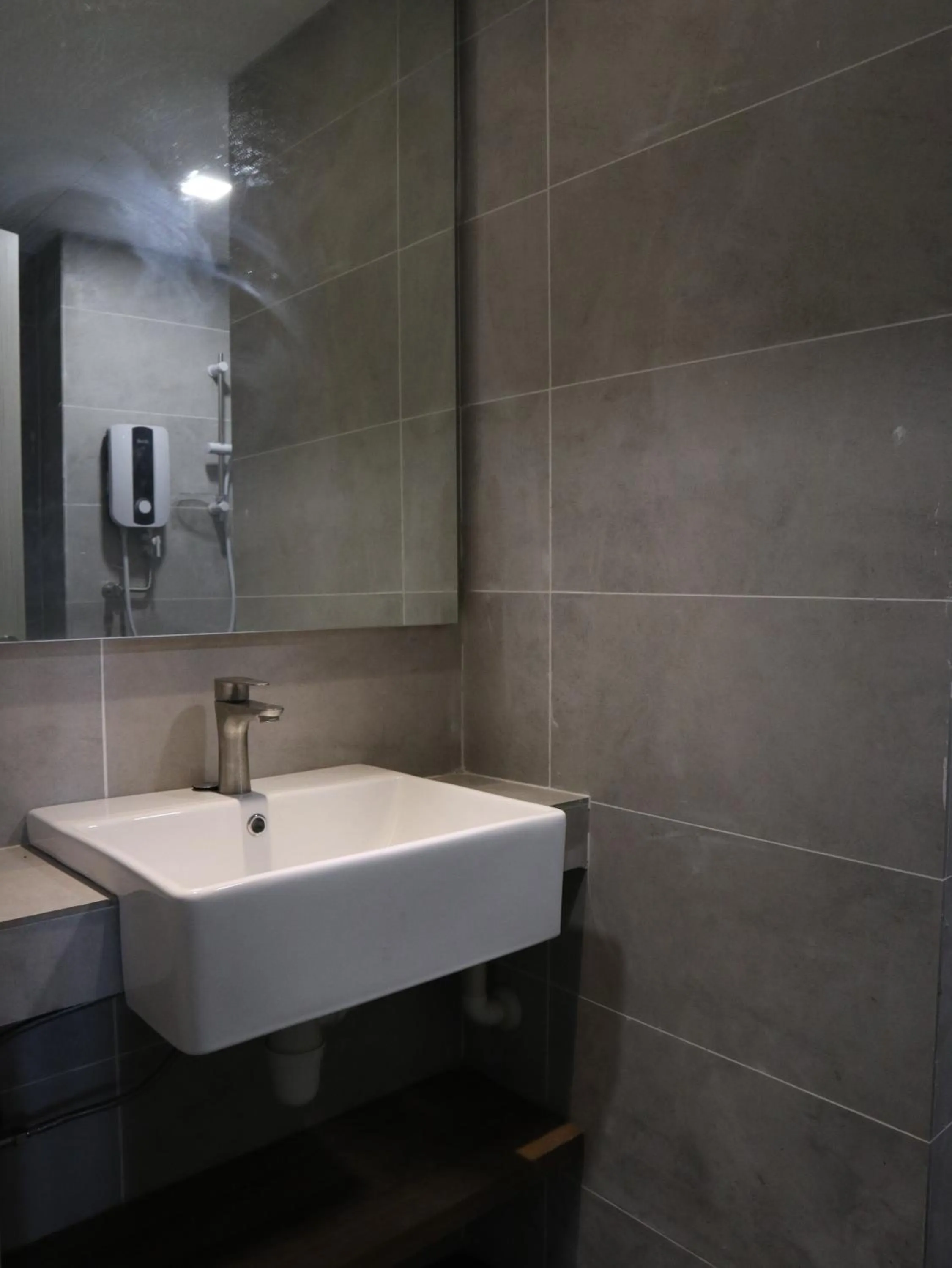 Bathroom in Roxy Sematan Villa & Townhouse