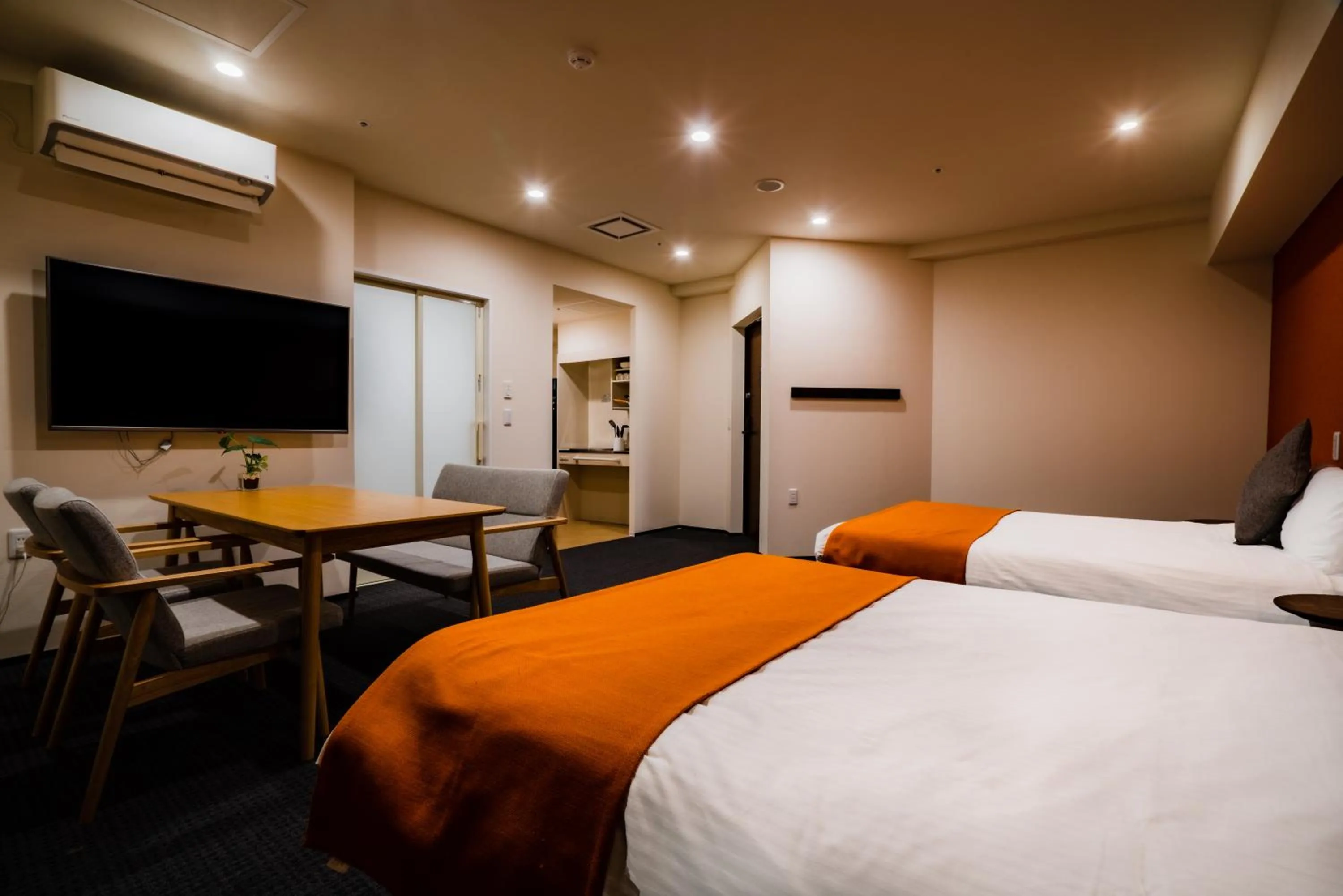 Photo of the whole room, Bed in Randor Hotel Sapporo Suites