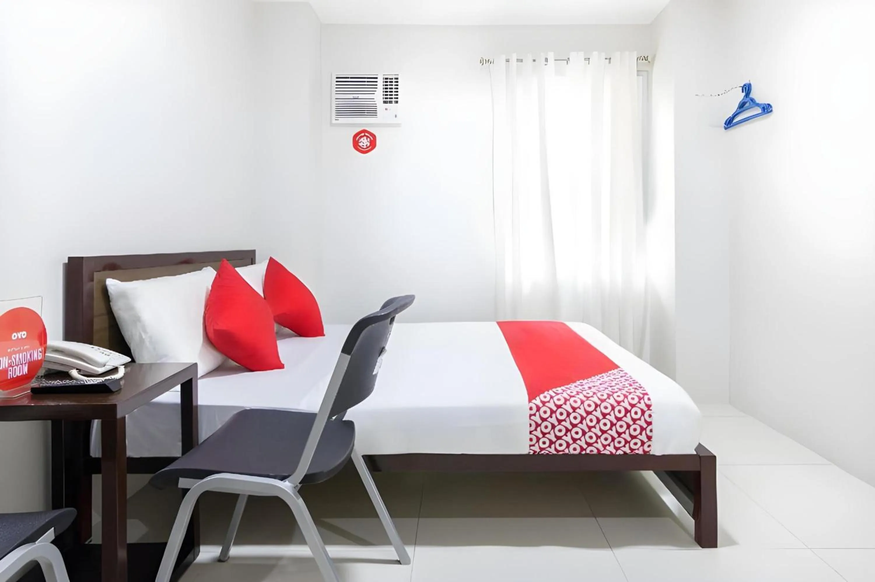 Bedroom, Bed in OYO 152 Sangco Condotel