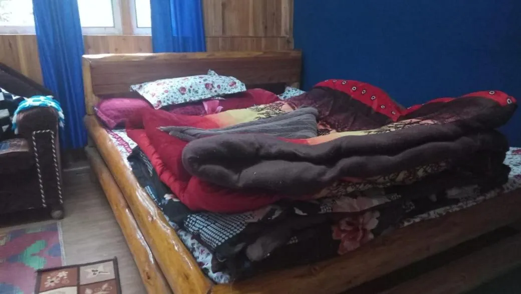 Bed in Sinkawli Homestay