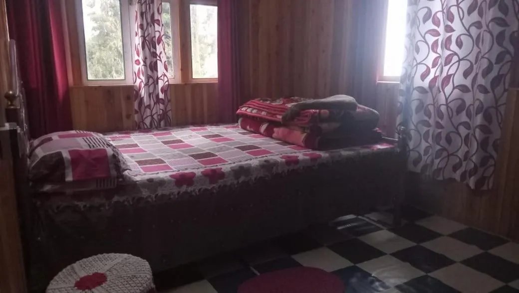Bed in Sinkawli Homestay