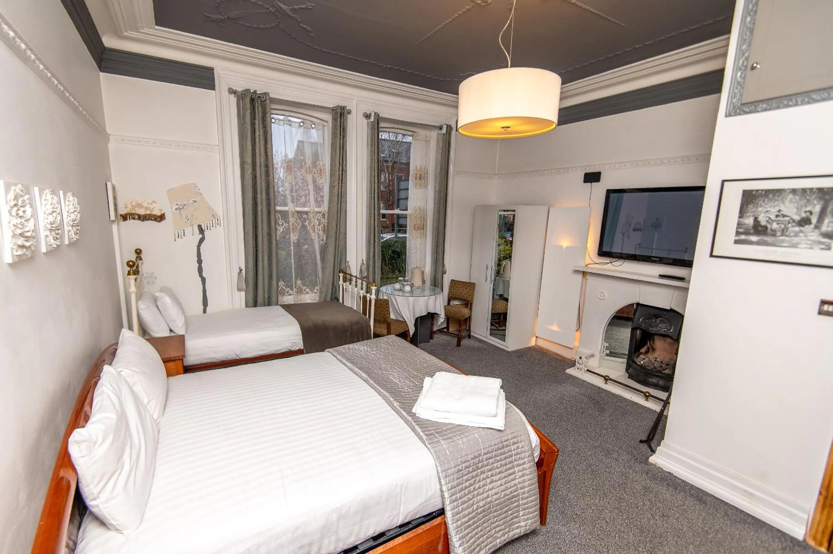 Bedroom, Bed in OYO Cornerstone Manor Hotel