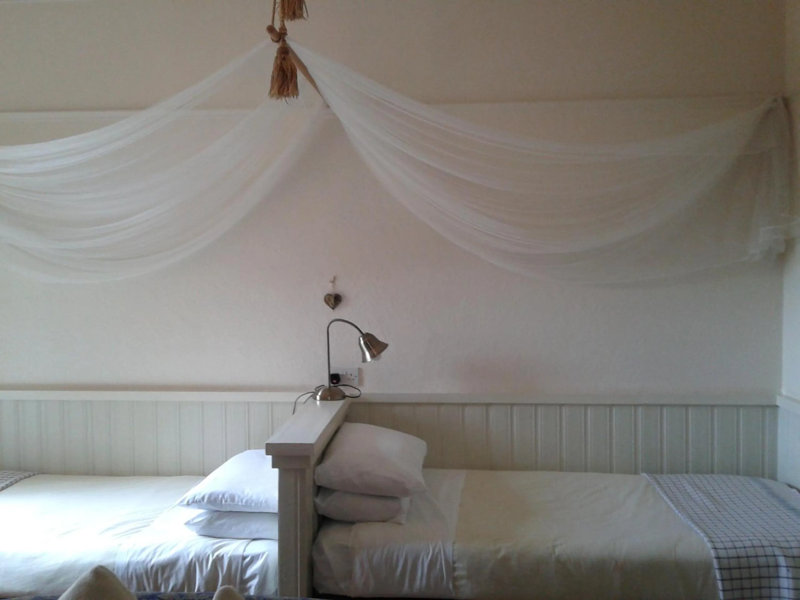 Decorative detail, Bed in OYO Cornerstone Manor Hotel