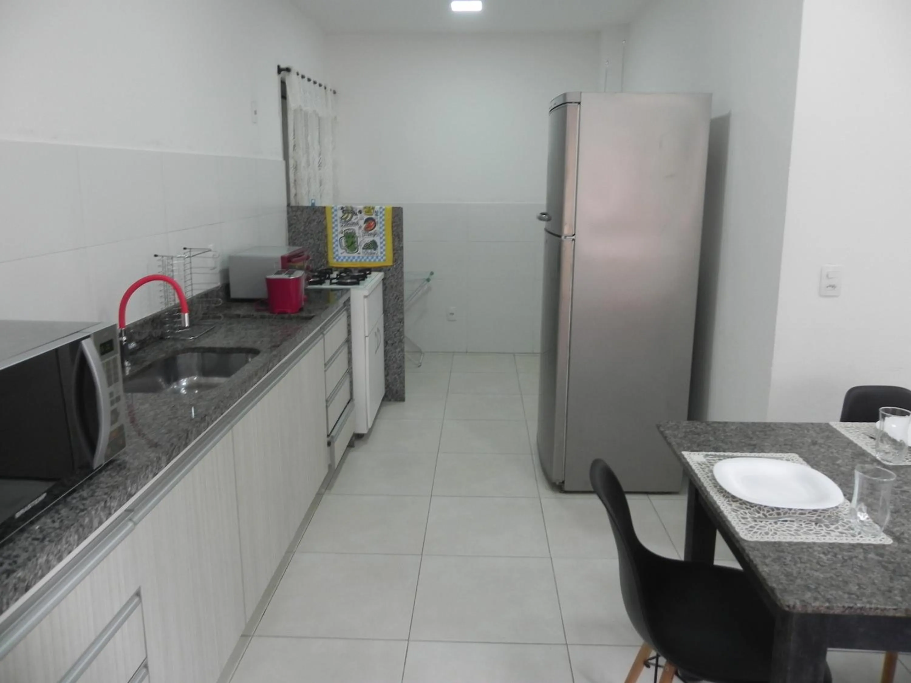 Communal kitchen in Aconchego Serra Imperial