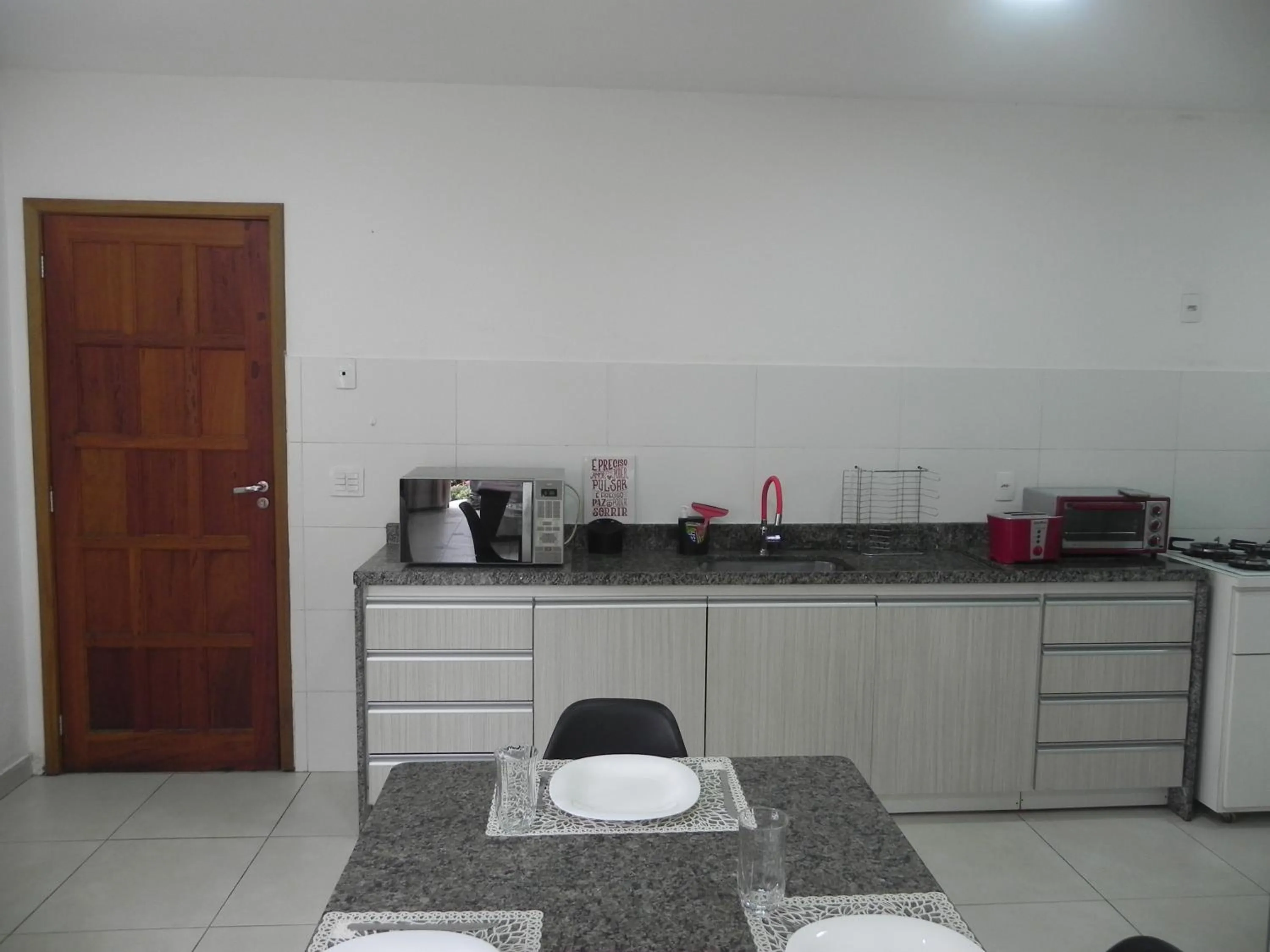 Communal kitchen in Aconchego Serra Imperial