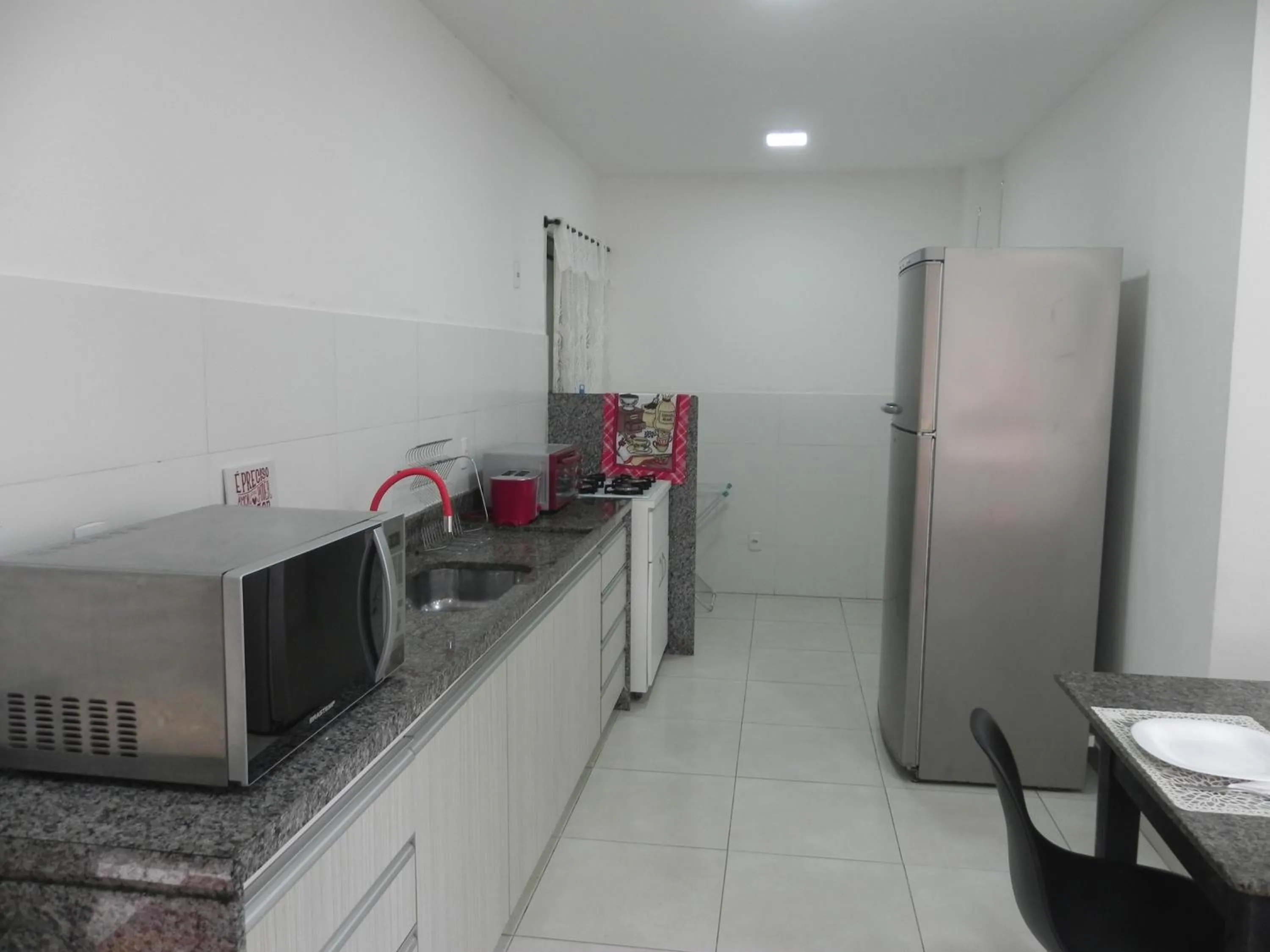Communal kitchen in Aconchego Serra Imperial