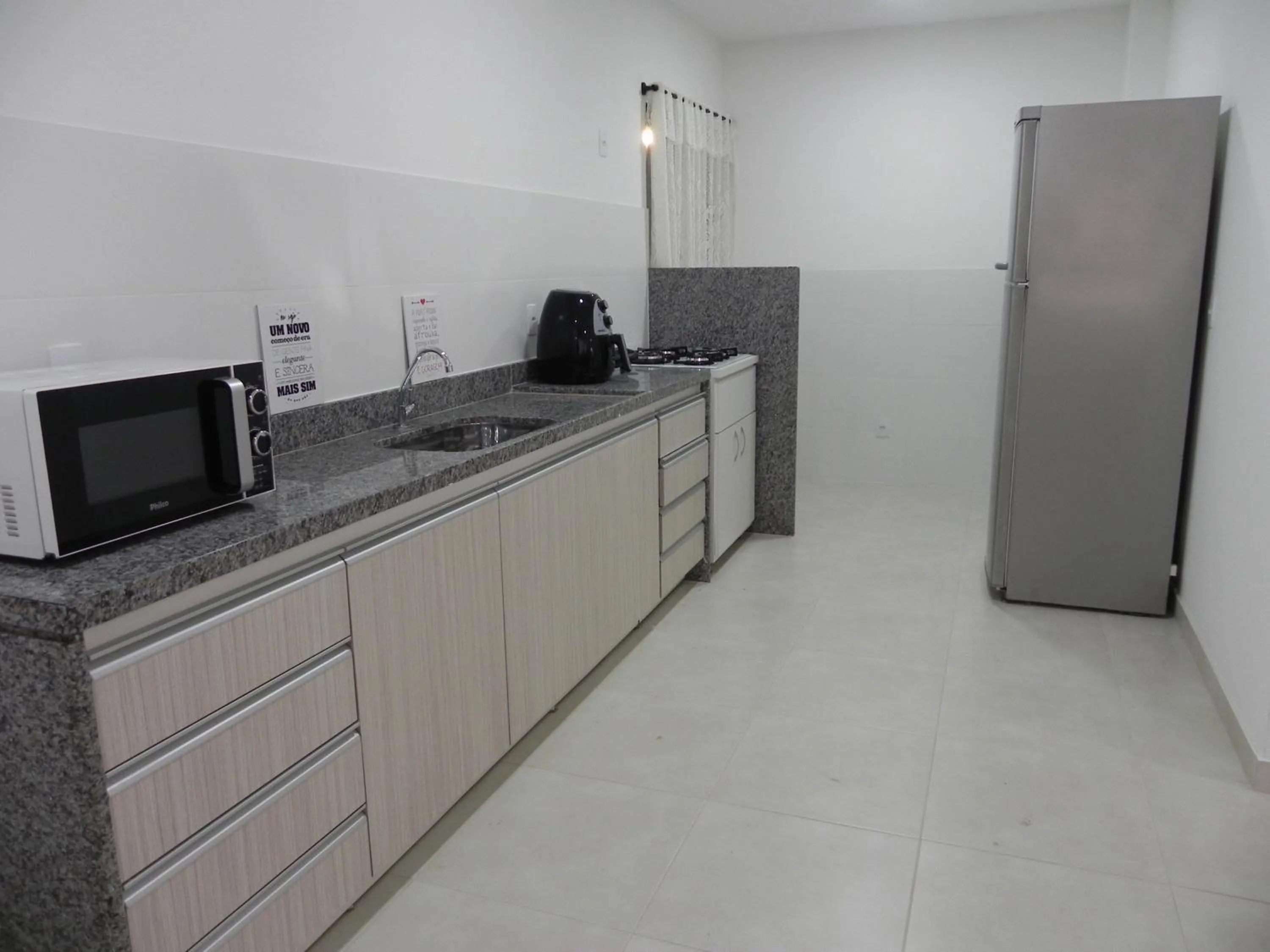 Communal kitchen in Aconchego Serra Imperial