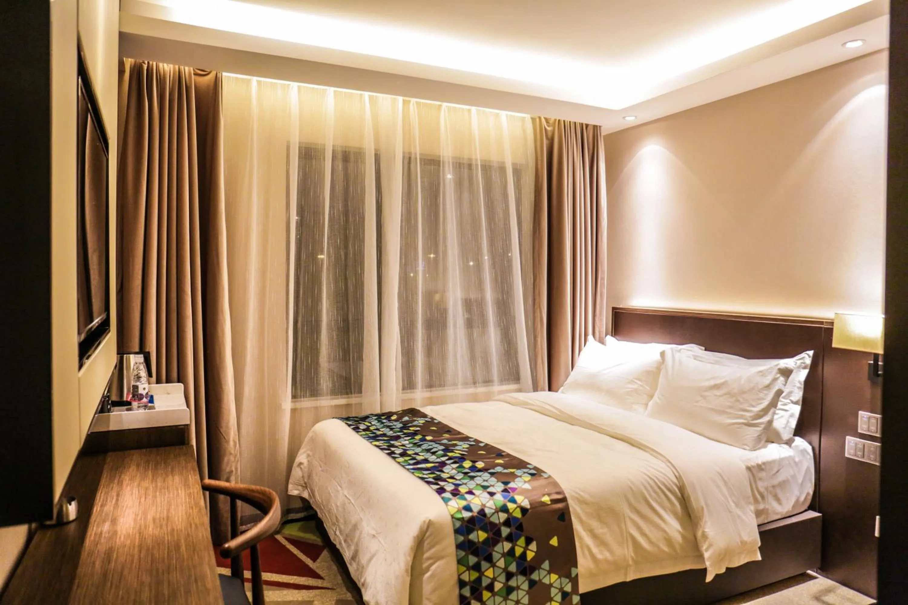 Bed in Chao Man Hotel(Guangzhou Pazhou Exhibition Center Chigang Subway Station)