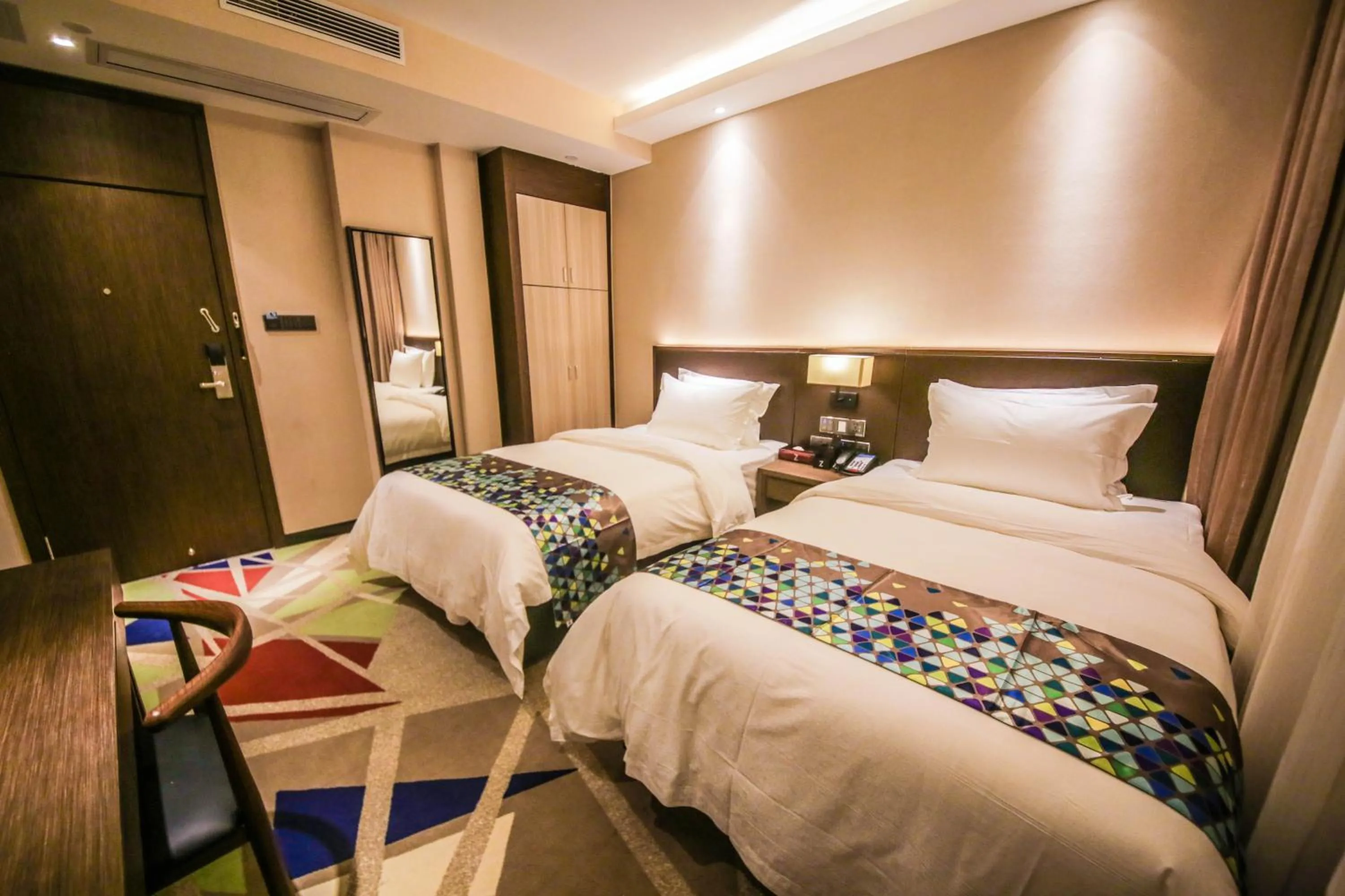 Bed in Chao Man Hotel(Guangzhou Pazhou Exhibition Center Chigang Subway Station)