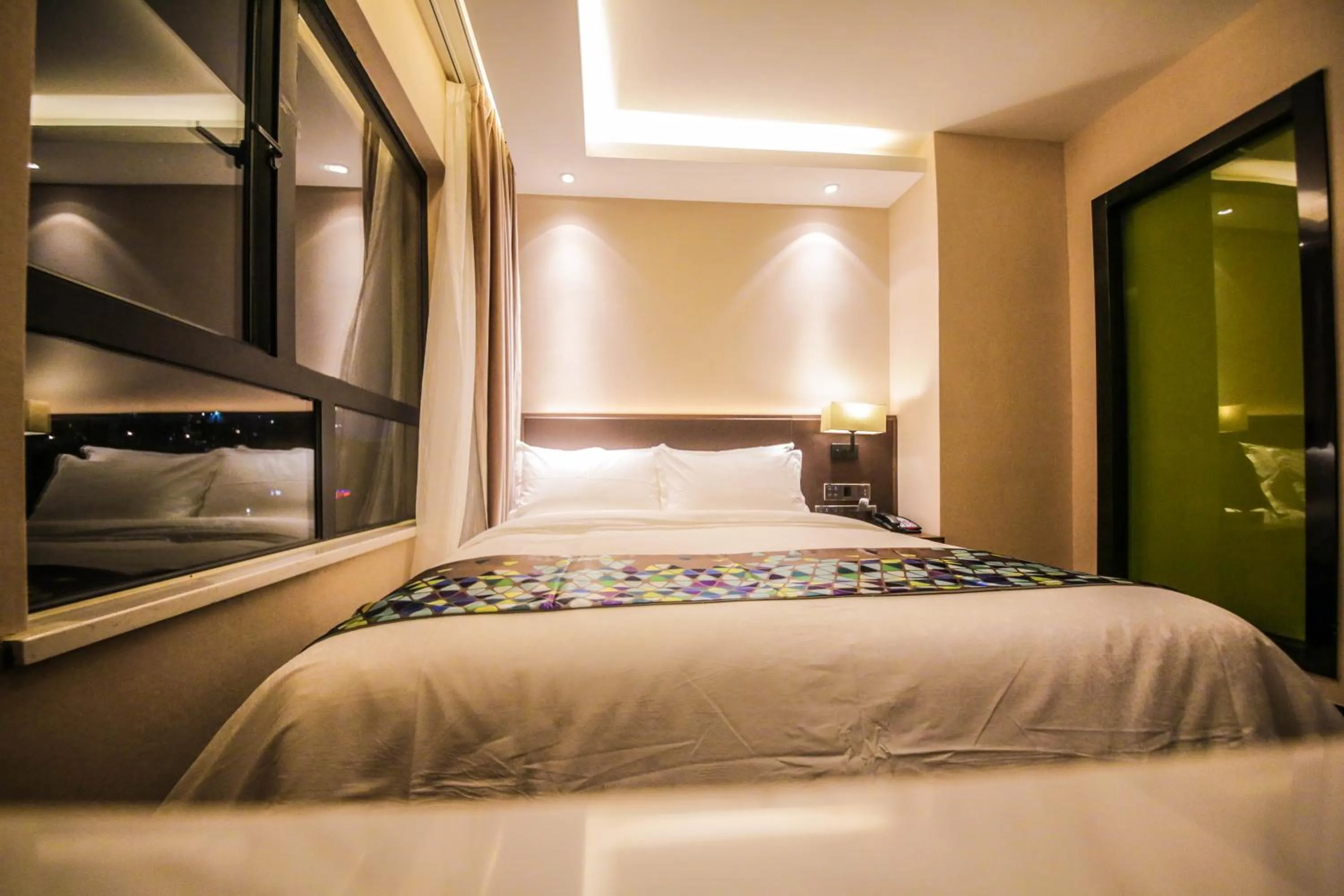 Bed in Chao Man Hotel(Guangzhou Pazhou Exhibition Center Chigang Subway Station)