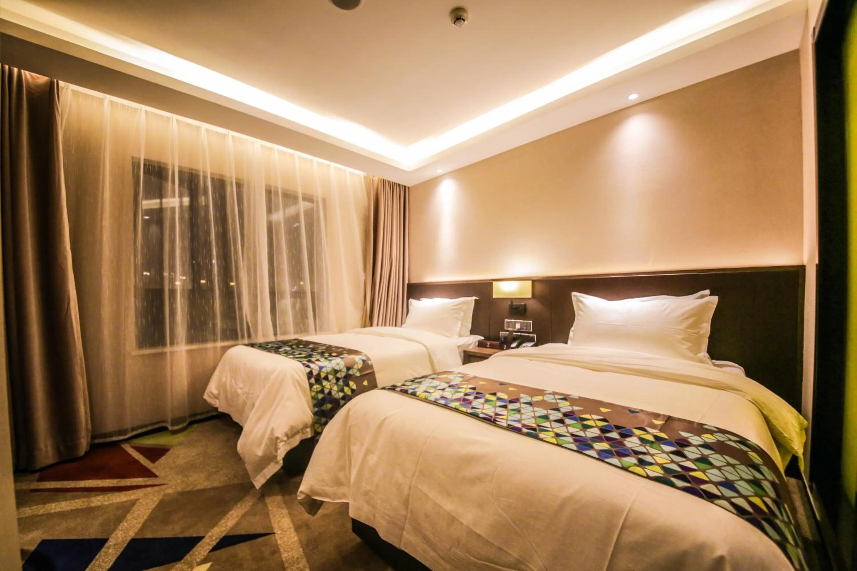 Bed in Chao Man Hotel(Guangzhou Pazhou Exhibition Center Chigang Subway Station)