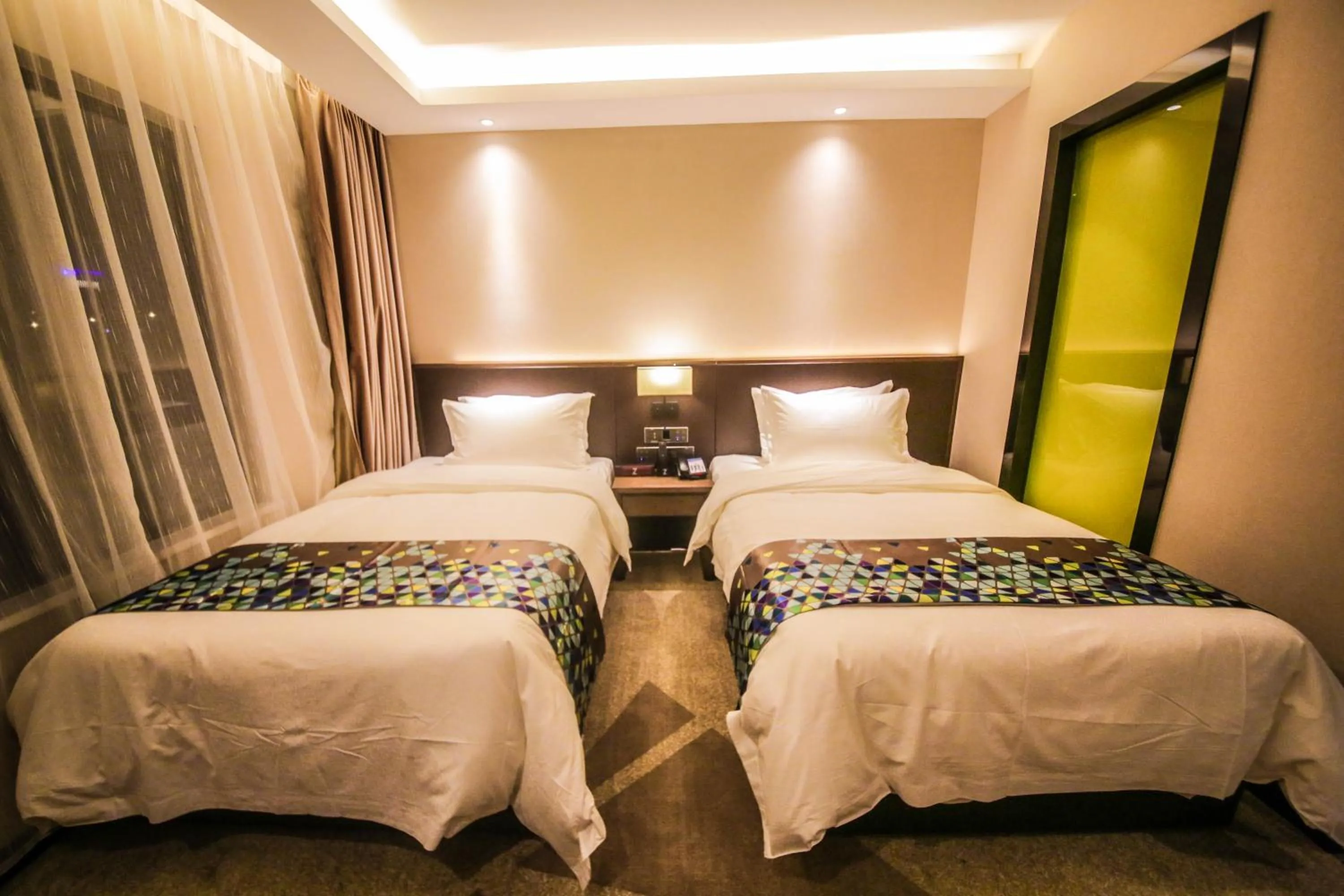 Bed in Chao Man Hotel(Guangzhou Pazhou Exhibition Center Chigang Subway Station)