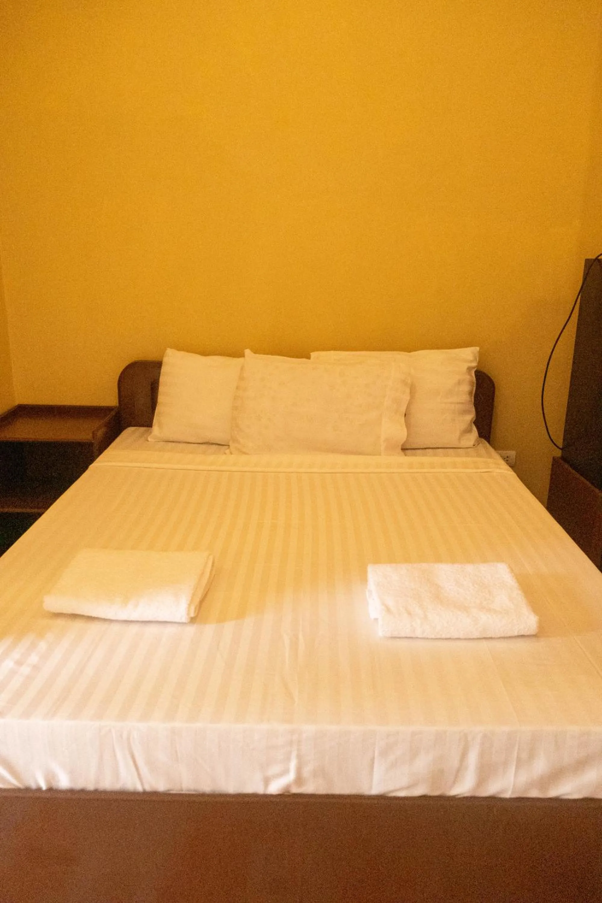 Bed in Oceanfront Beach Resort