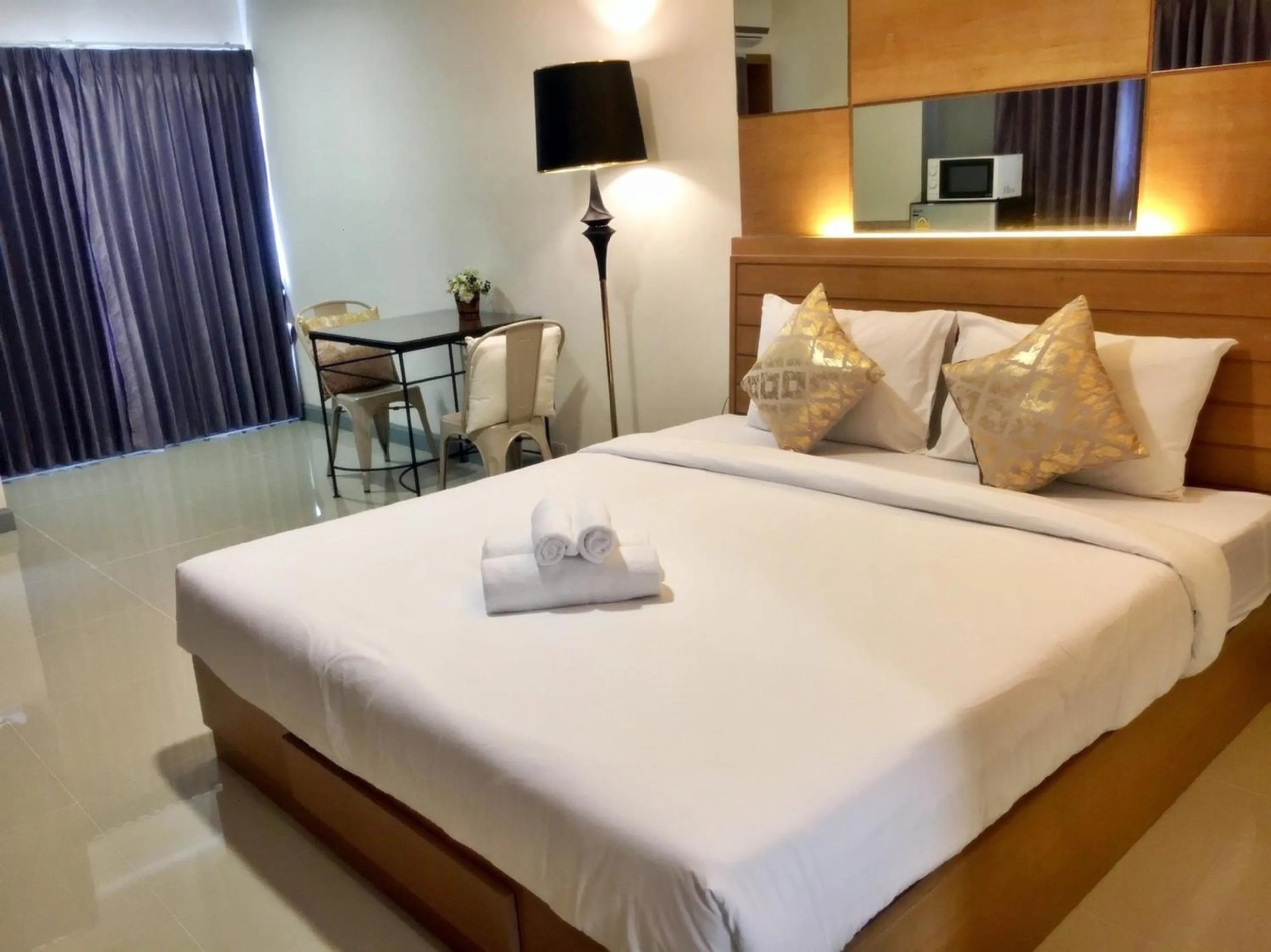 Bed in The Greenery central suite & hotel