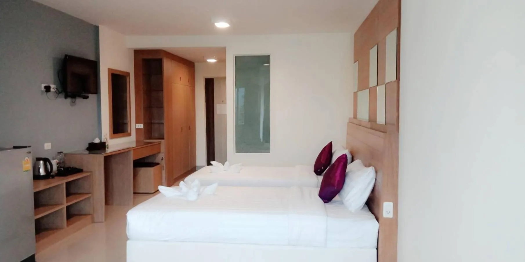 Bed in The Greenery central suite & hotel