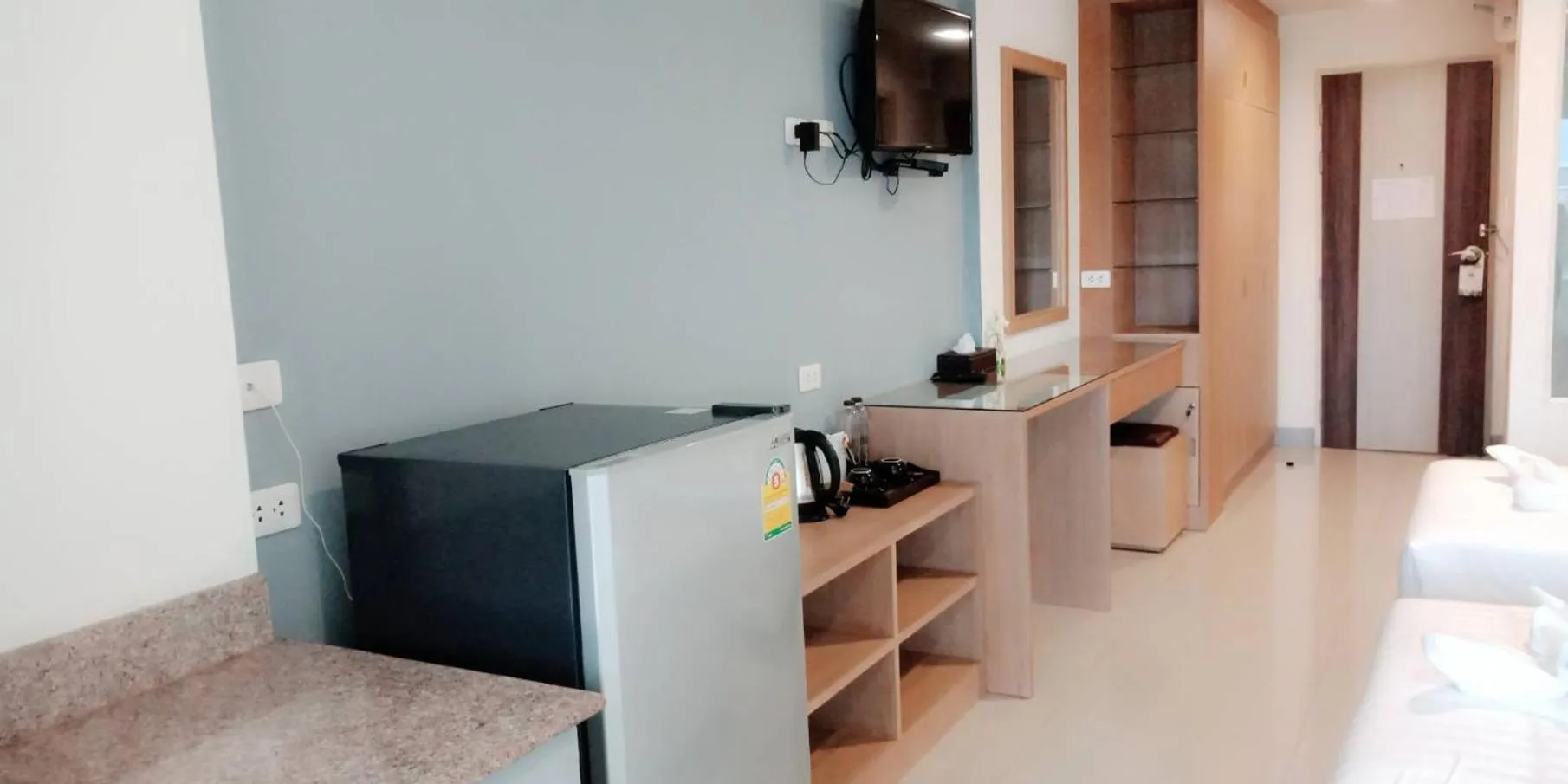 TV and multimedia in The Greenery central suite & hotel