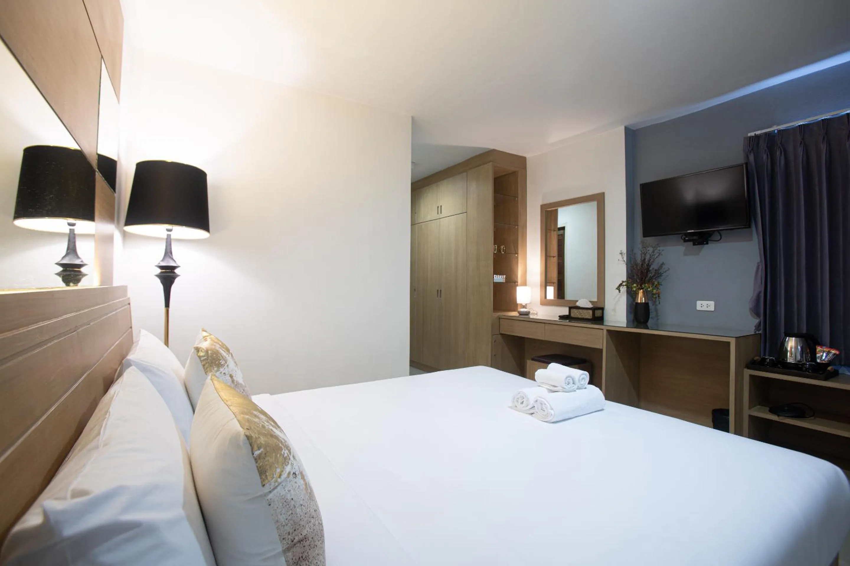 Bed in The Greenery central suite & hotel