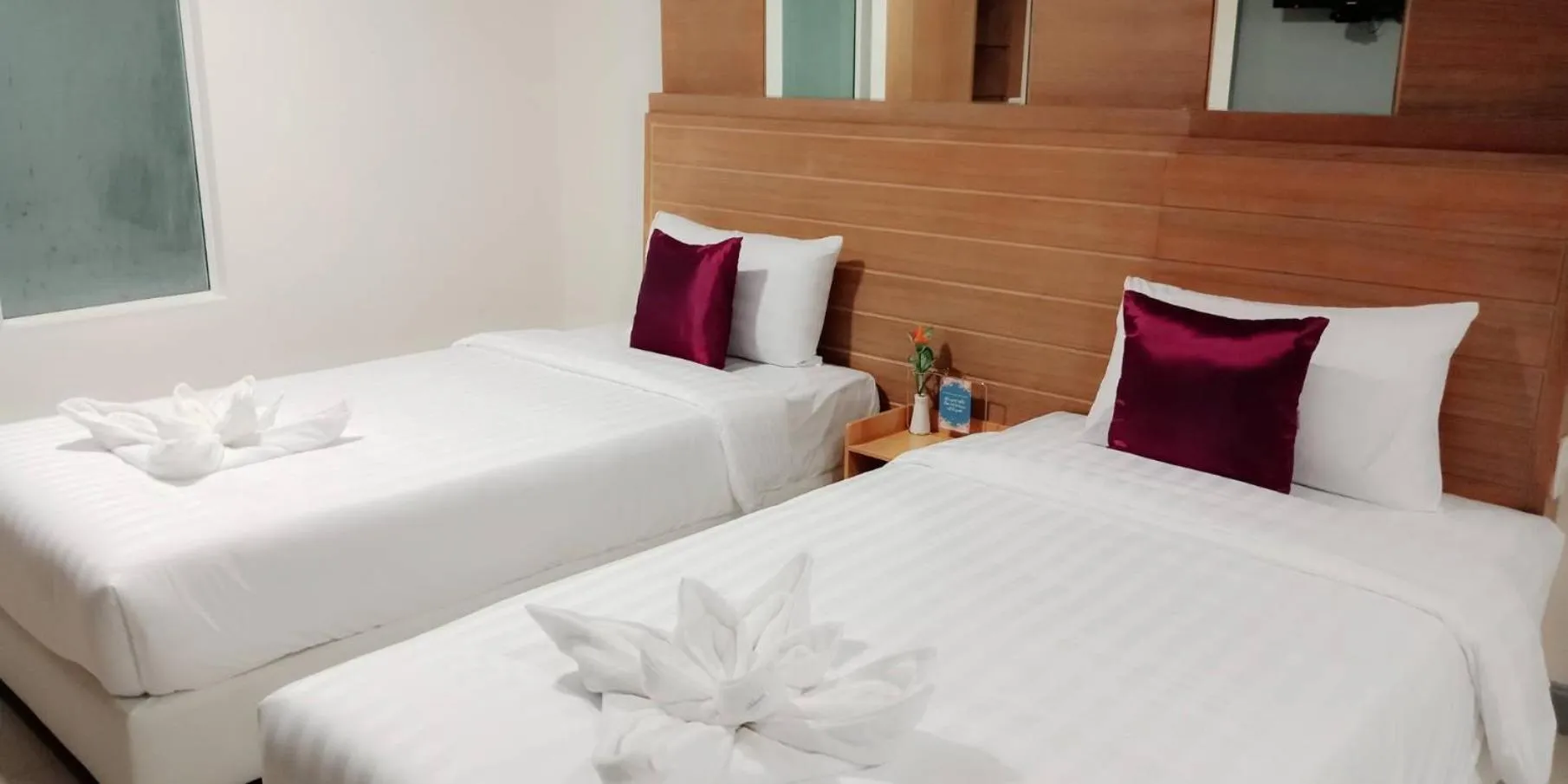 Bed in The Greenery central suite & hotel