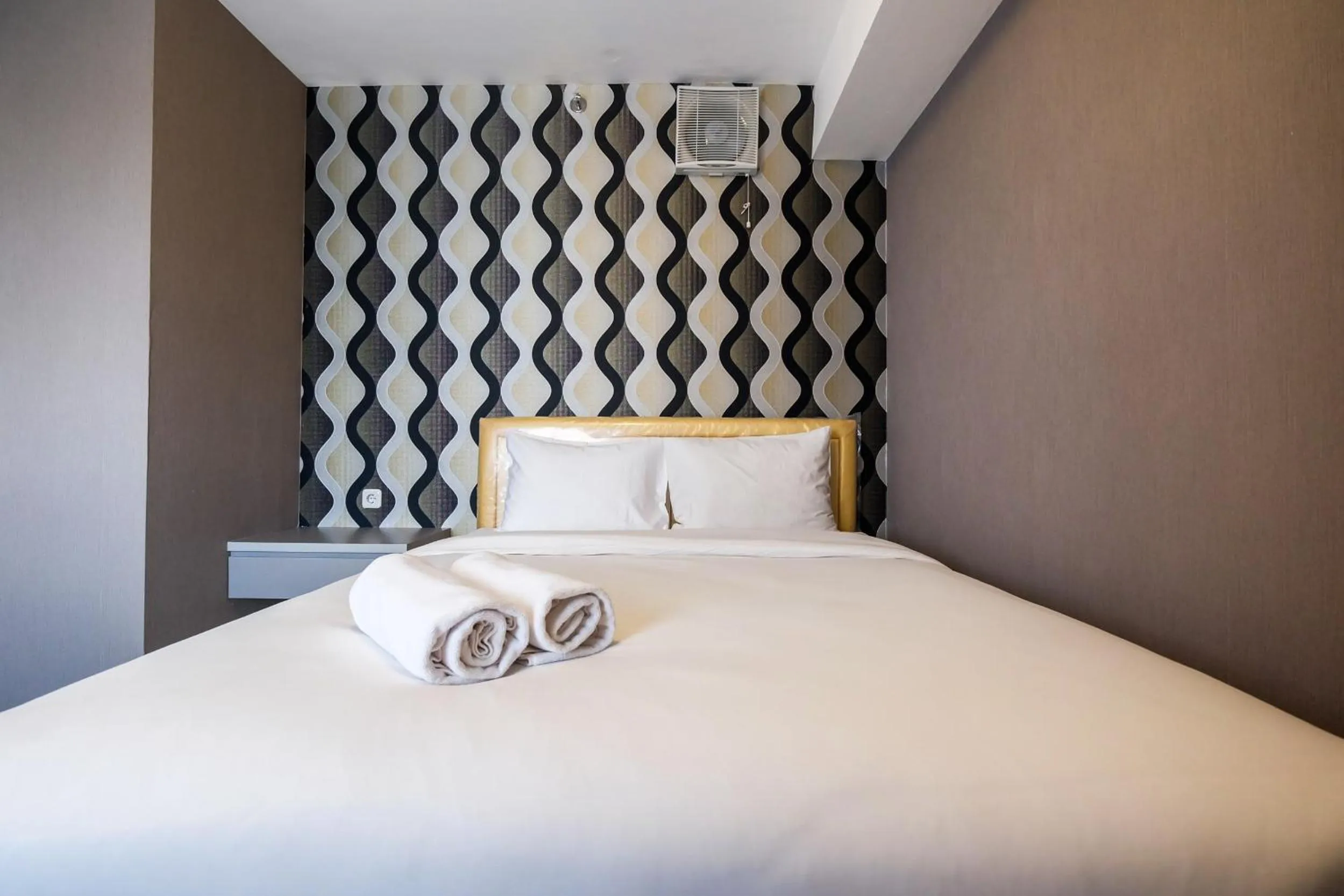 Bed in Modern and Comfort 2BR Bassura City Apartment By Travelio