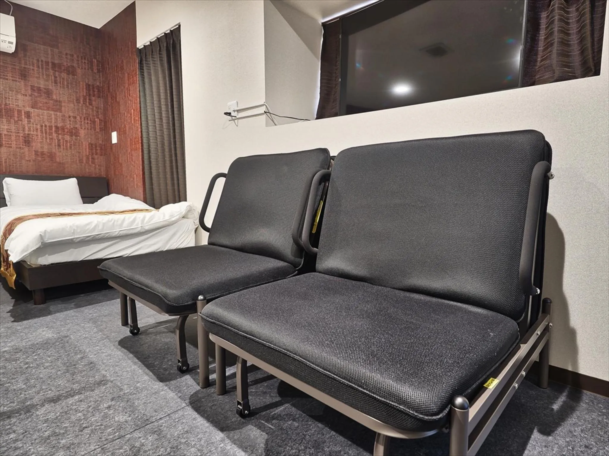 Living room, Bed in Okinawa City Hotel