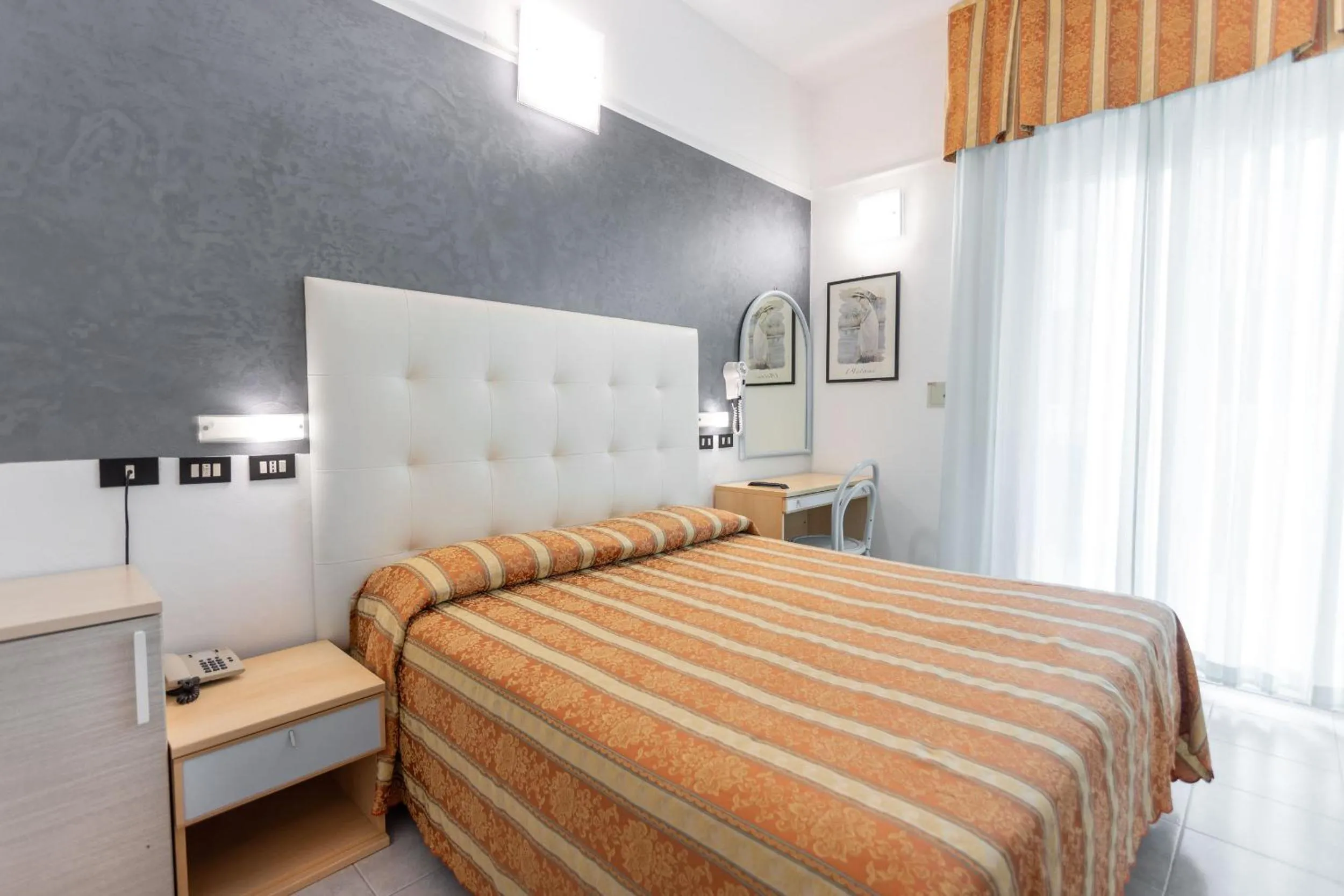 Bed in Hotel Nettuno