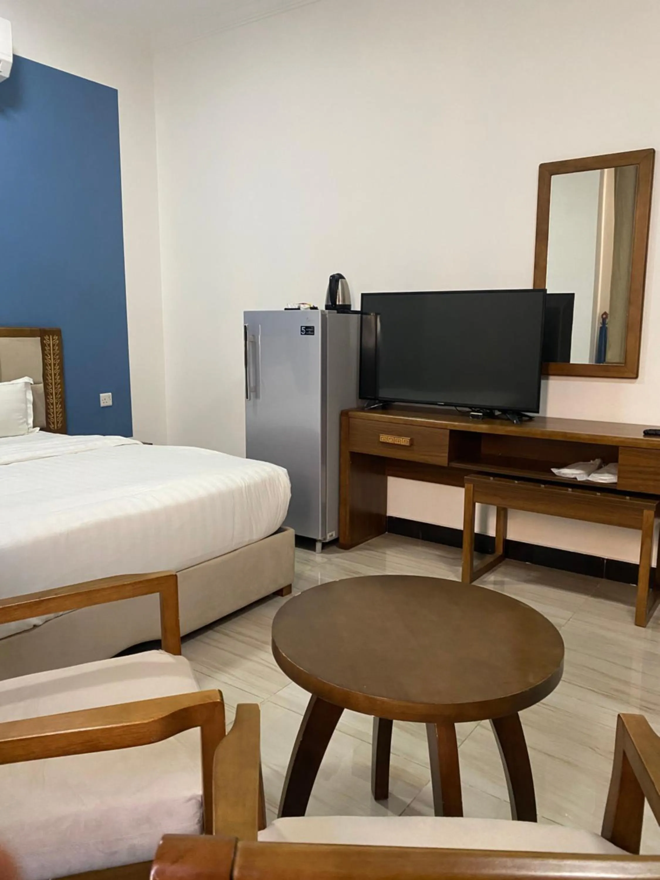 Bed in Home Station Hotel