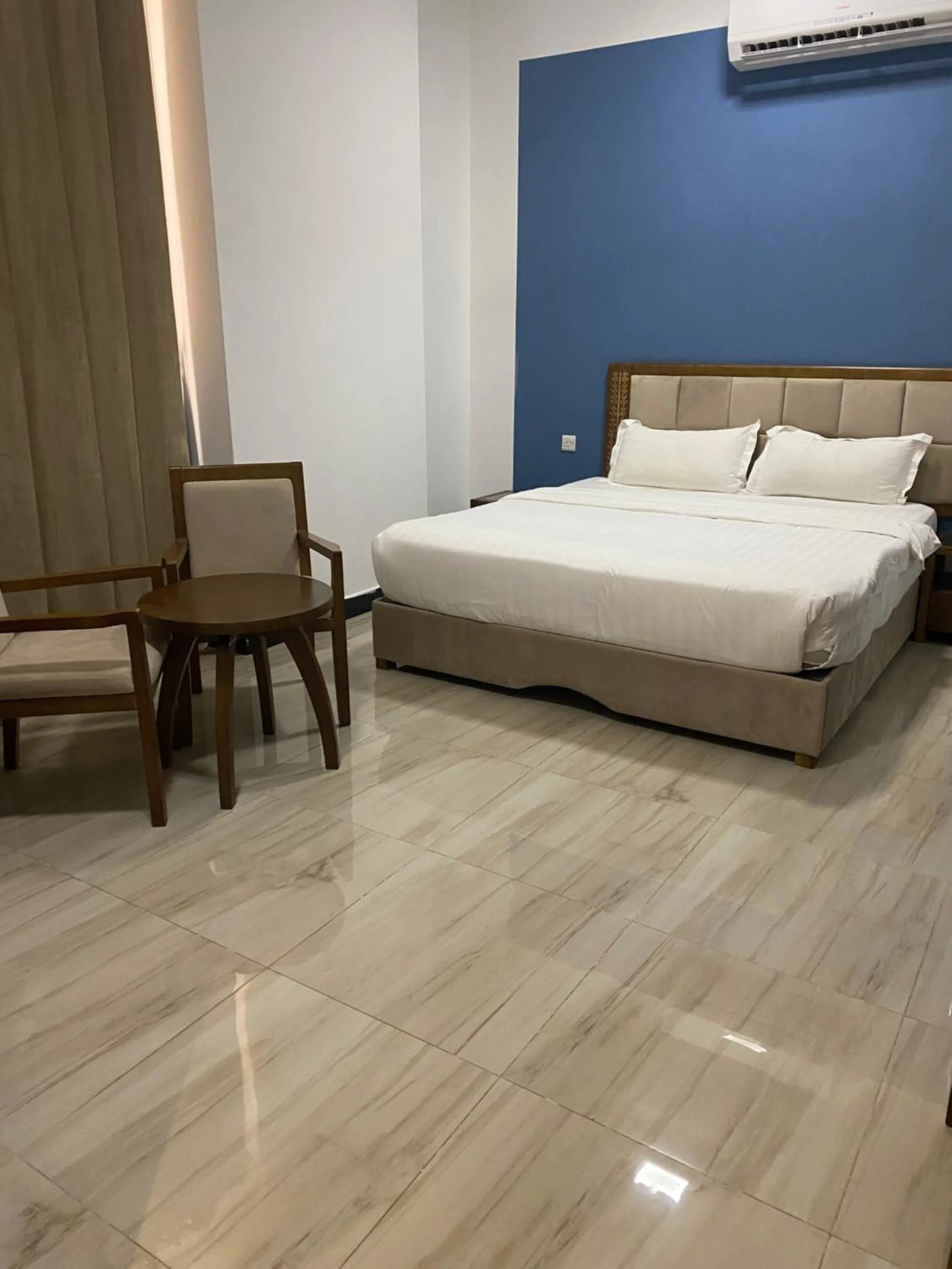 Bed in Home Station Hotel