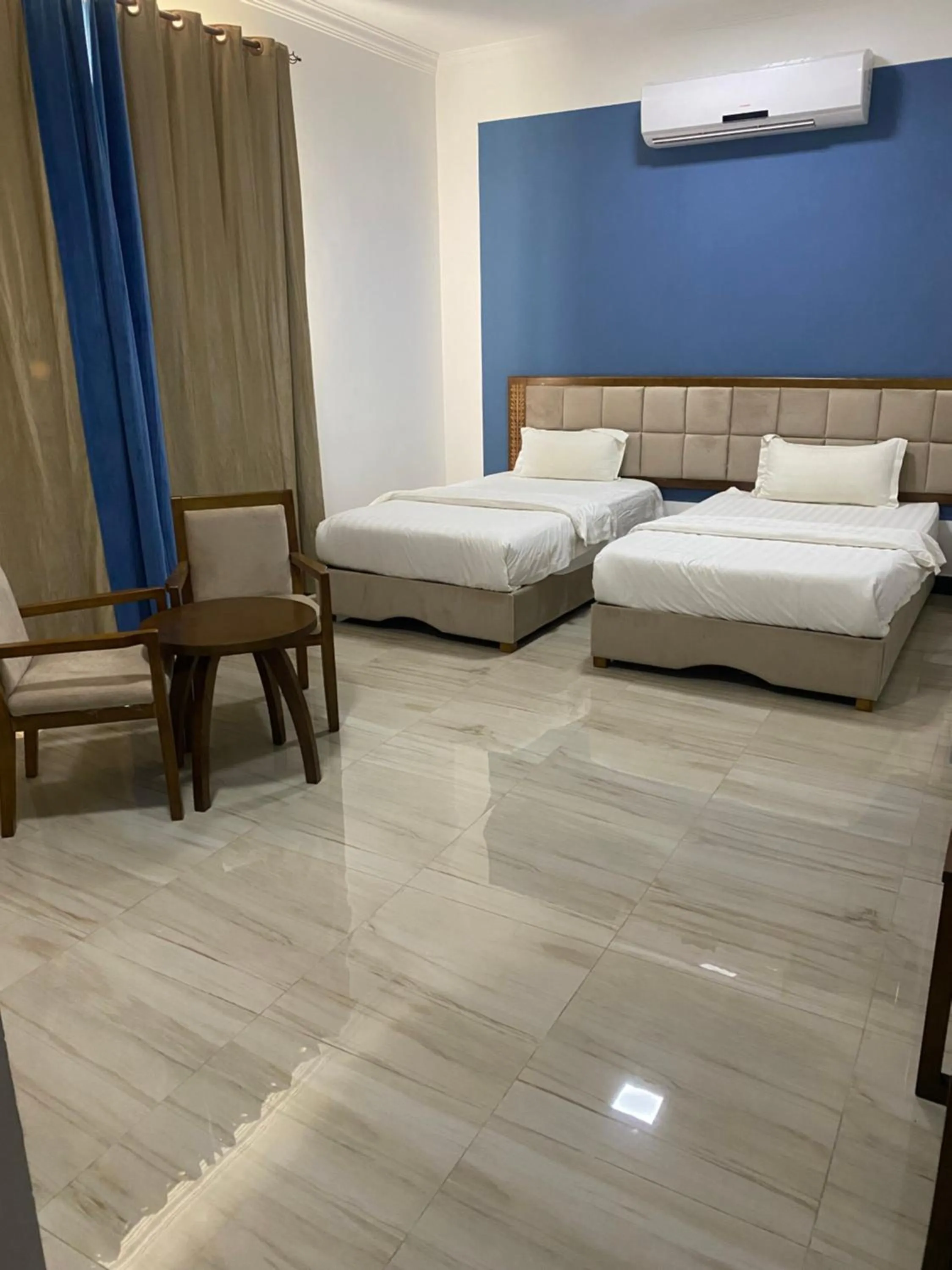 Bed in Home Station Hotel