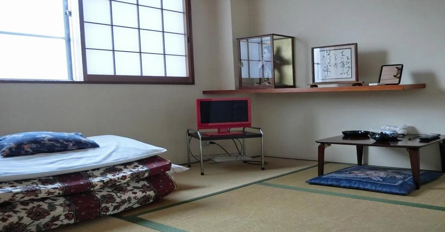 Bed in Ryokan Suzukisou-tatami room No bath and toilet- Vacation STAY 17862